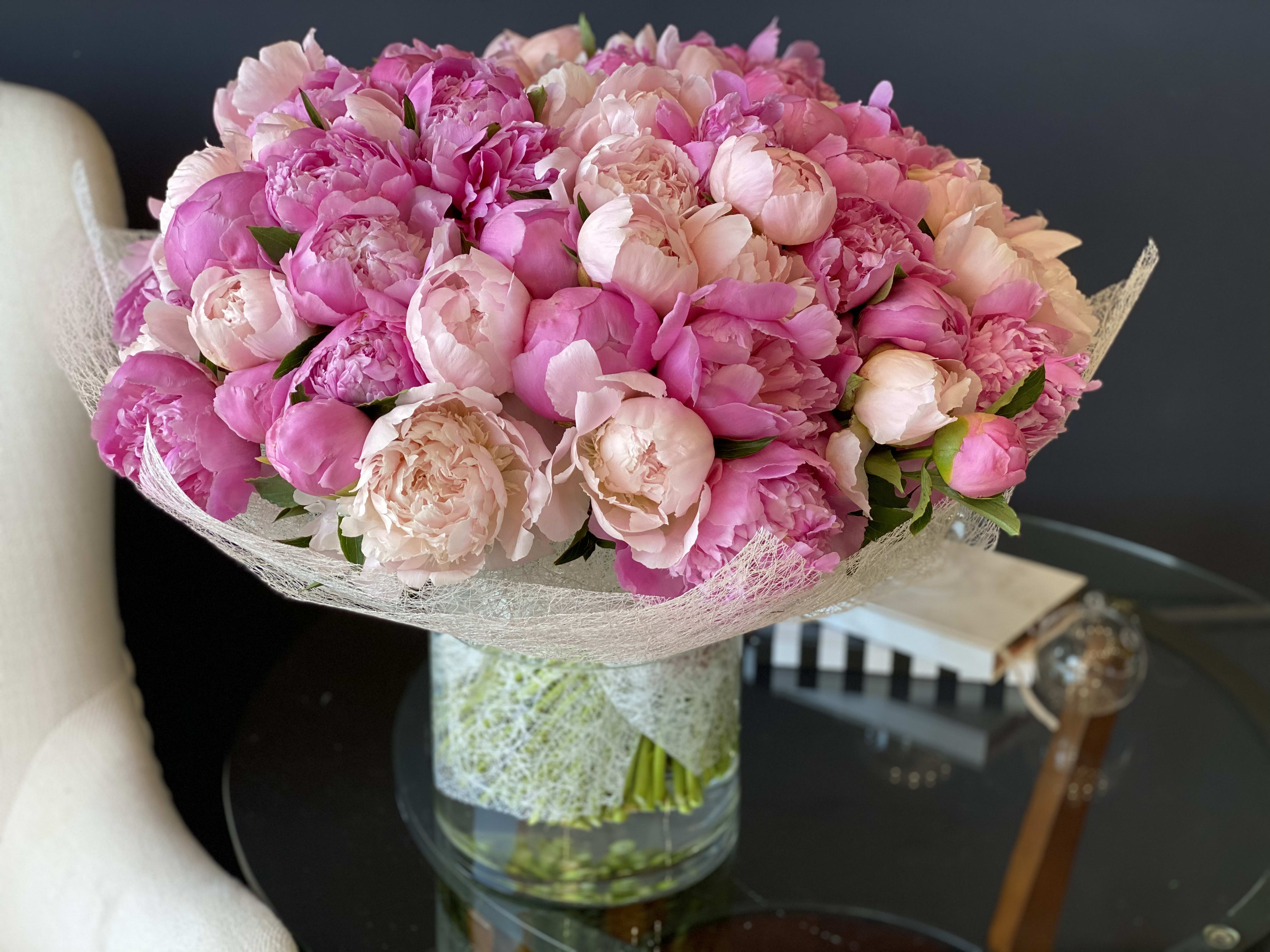 100 Peonies Arrangement in Vase  - Hand-crafted Bouquet with 100 stems of luxurious peonies in clear vase.