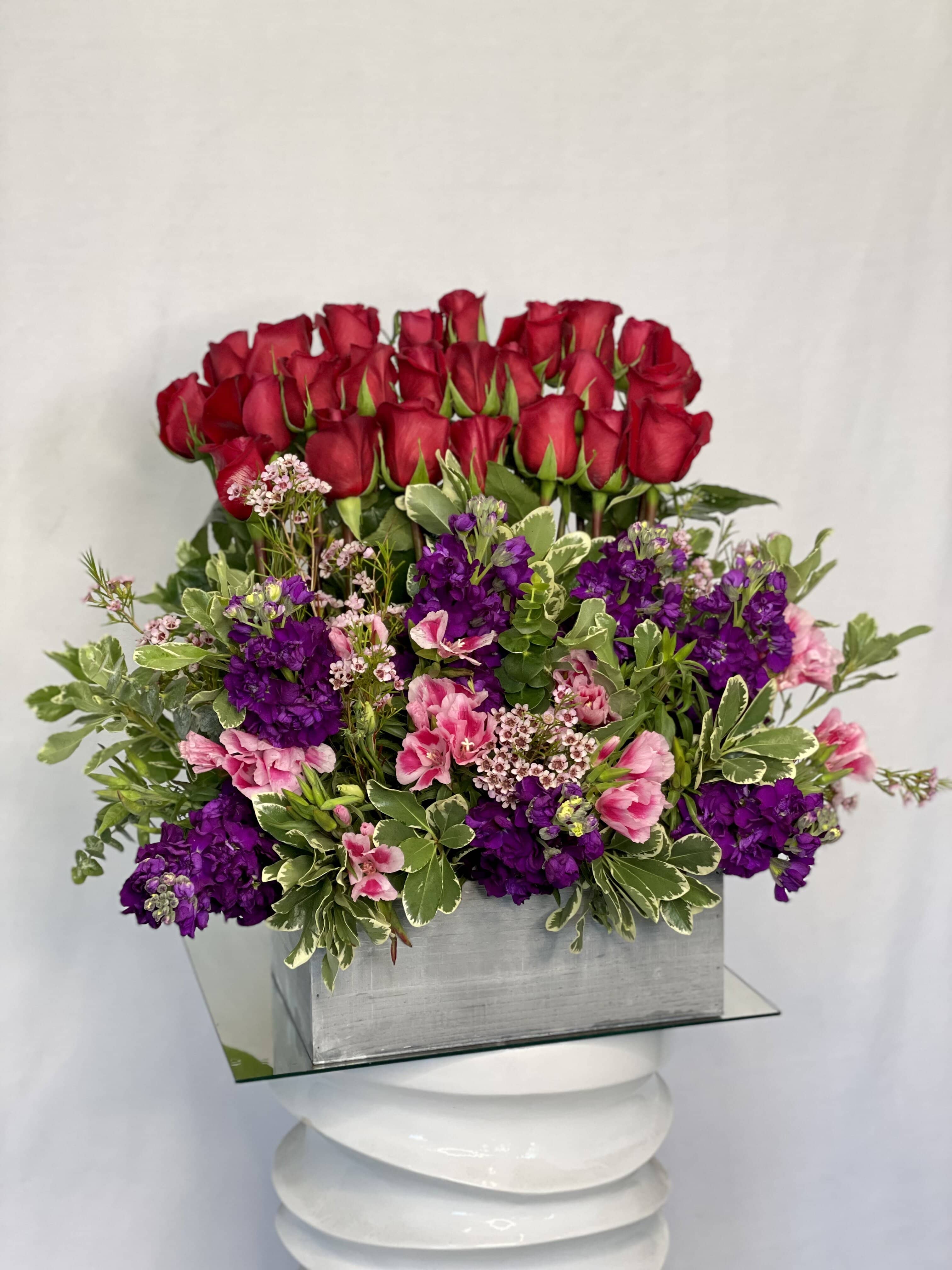 Glamorous   - This arrangement is a full statement and brings color to any room. 