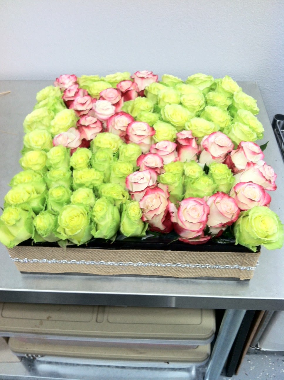 Hugs and Kisses with Roses - This affectionate display features two types of beautiful roses. 