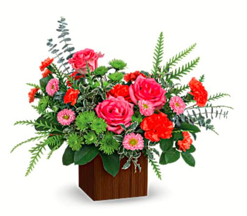 Catch the Sun - Heat things up with happy, hot pink roses and fresh green mums! The sunny arrangement is presented in a stylish bamboo cube for a modern touch. Hot pink roses, orange carnations, miniature orange carnations, pink matsumoto asters and green cushion spray chrysanthemums are accented with lemon leaf, spiral eucalyptus and pitta negra. 
