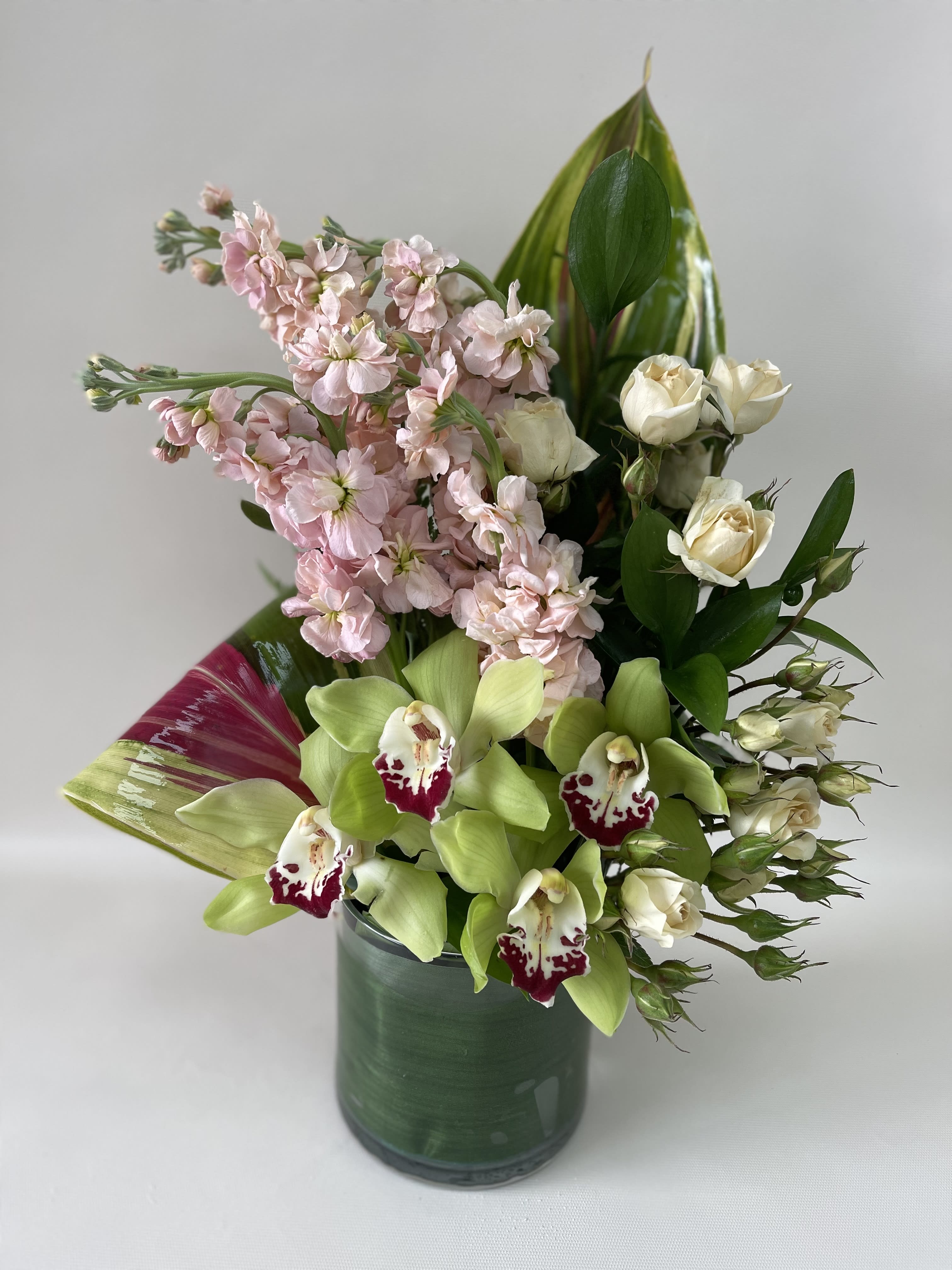 Vintage Bloom Vintage Bloom - Awesome one side arrangement with a beautiful green cymbidium and pink stocks. (Any color can be substitute).