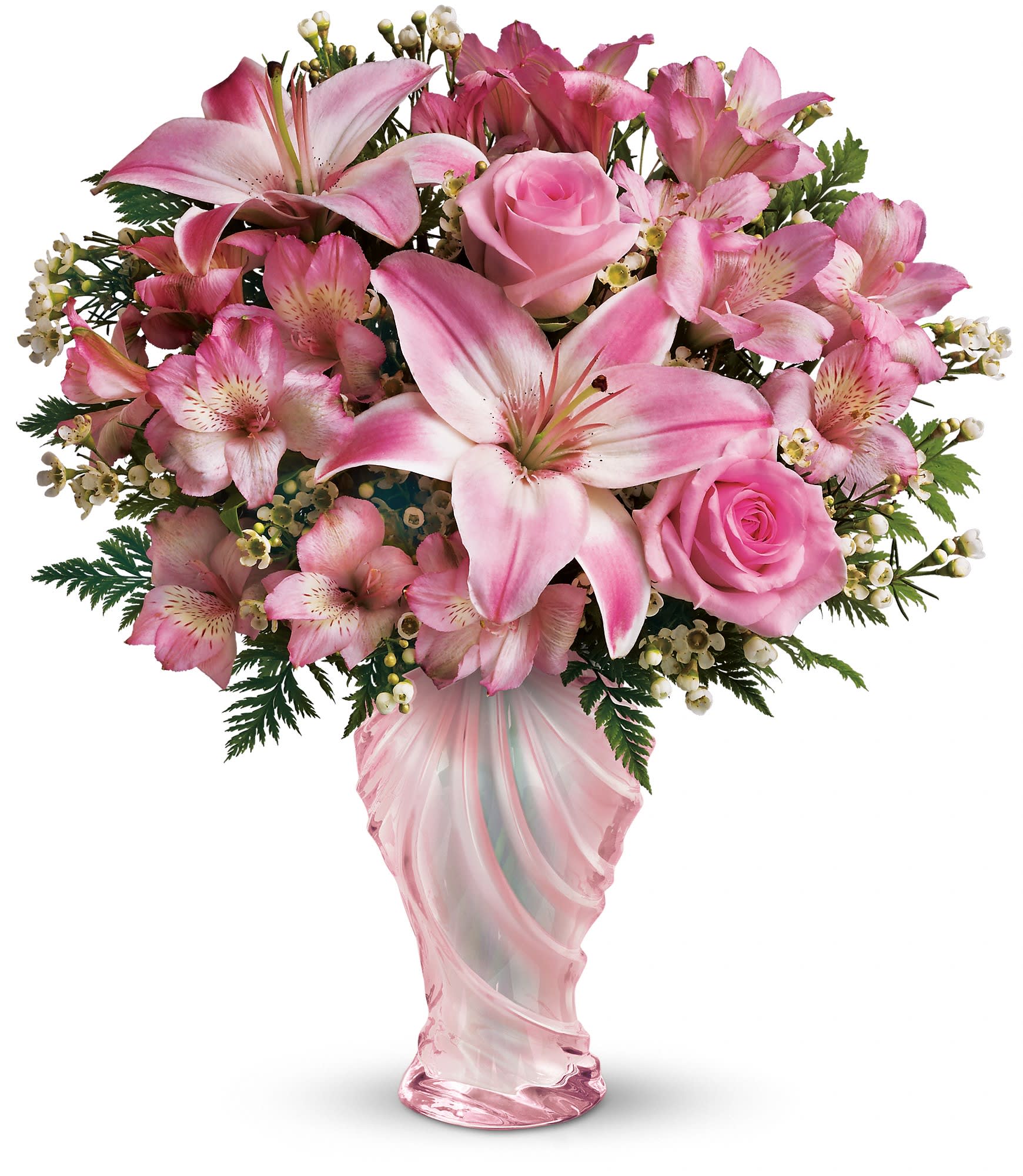 Teleflora's Charm &amp; Grace Bouquet - The elegant bouquet includes light pink roses, pink asiatic lilies, light pink alstroemeria and white waxflower, accented with leatherleaf fern. Delivered in a sculpted pink glass vase. T12M110A