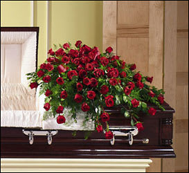 Lush Rose Casket Flowers  - Orchids  florist in Waterbury  A richly designed floral casket arrangement of elegant &amp; classy red roses that luxuriously cascade over the foot of the casket.