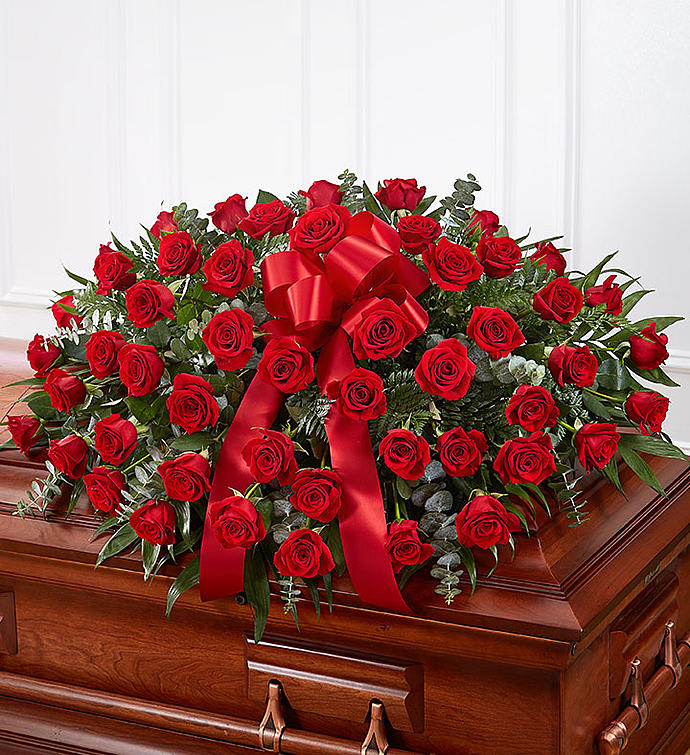 Red Rose Half Casket Cover - An abundance of red roses will express your love and devotion with beauty. This classic casket spray of roses mixed with greenery will be a fragrant reminder on a solemn day.