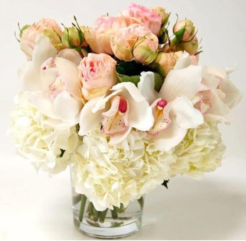 White Spring - Send your own special message with this arrangement of Sexy Red Garden Roses with a bold accent of Orchids in a pedestal Vase.