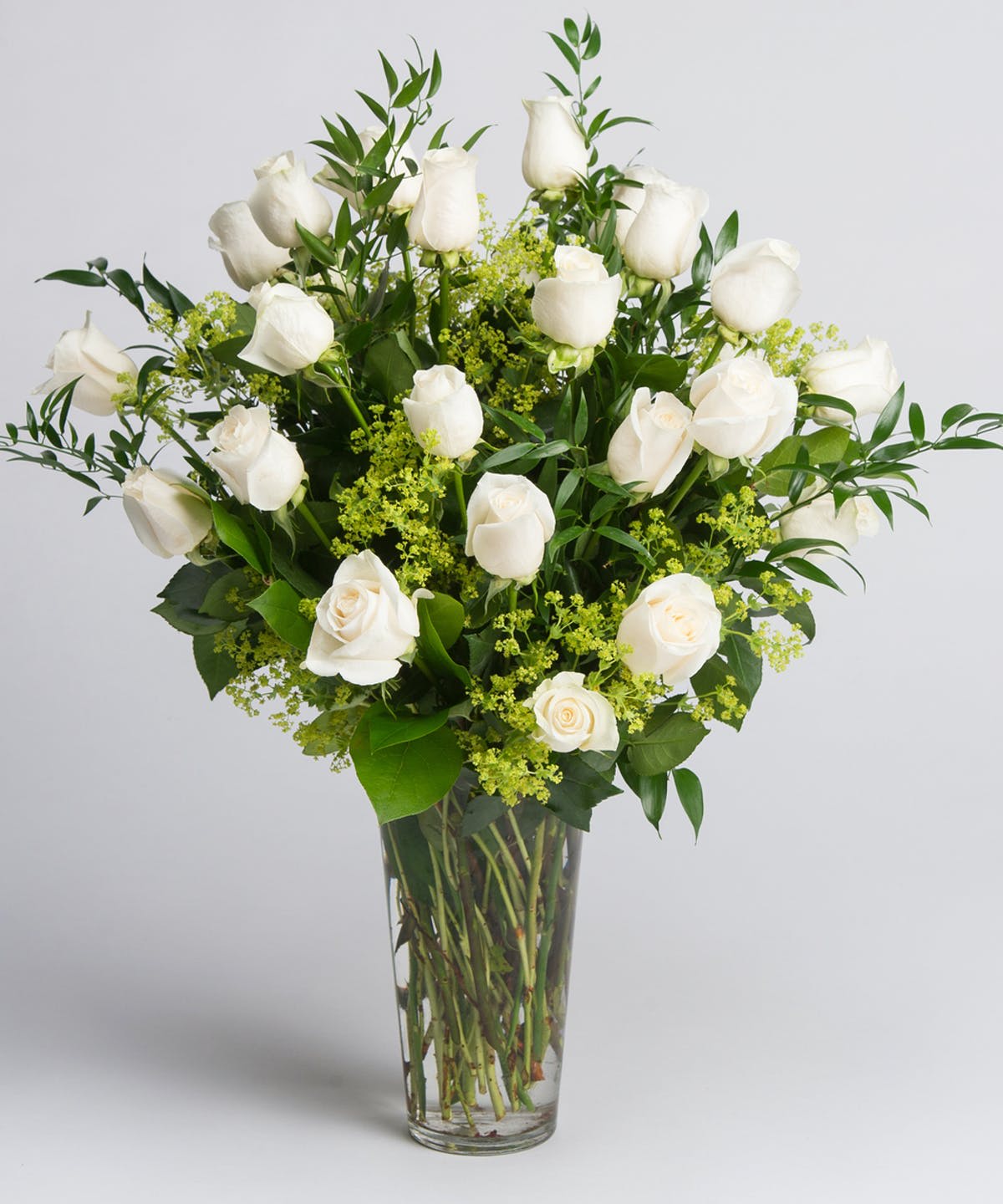 Blanc de Blanc Roses - An elegant arrangement of all premium white long stem white roses with simple greenery and filler. 