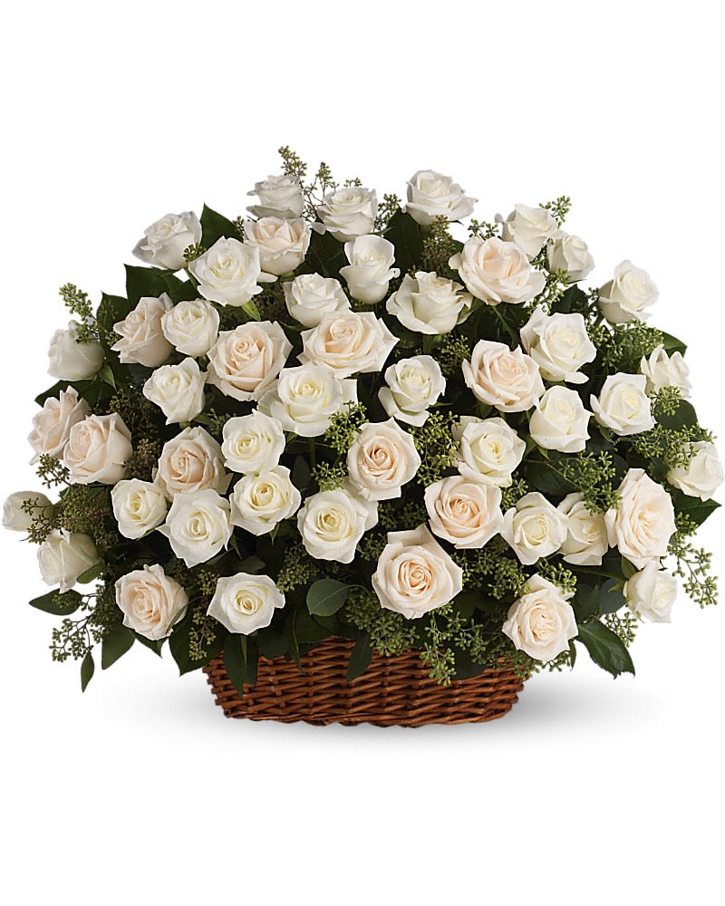 KF_T233-1A Bountiful Rose Basket KF_T233-1A Bountiful Rose Basket - A beautiful bountiful basket of luminous white roses that feels so fresh natural and welcomed in a home or at a service. White and crème roses with fragrant seeded eucalyptus beautifully presented in a large basket.