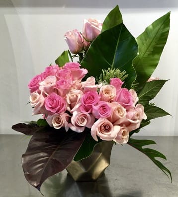 Shades of Pink - Custom arrangement of pale pink &amp; pink roses with exotic foliage in ceramic container