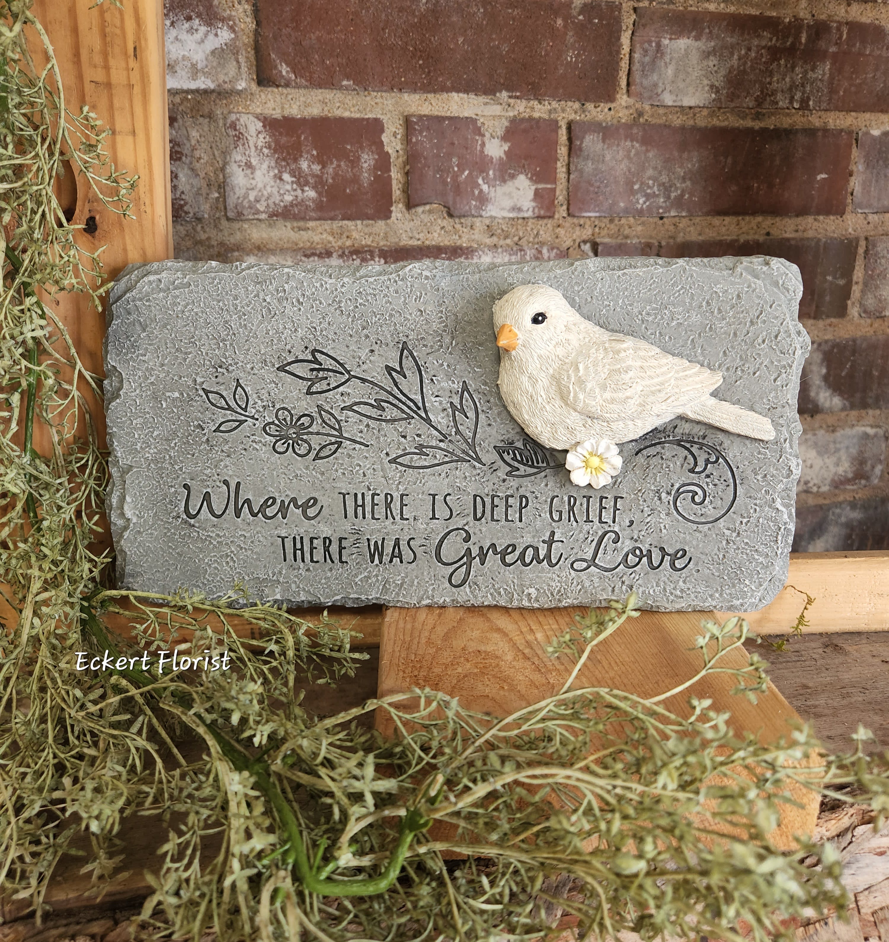 Eckert Florist's "Great Love" Dove Memorial Stone Eckert Florist's "Great Love" Dove Memorial Stone - Sentiment: "Where there is deep grief, there was Great Love." Resin stone measures approx. 10.75" W X 5.5" H *May be added to a fresh arrangement or green plant. See Deluxe and/or Premium upgrades. *See Add-on Section for Display Easel *LOCAL DELIVERY ONLY