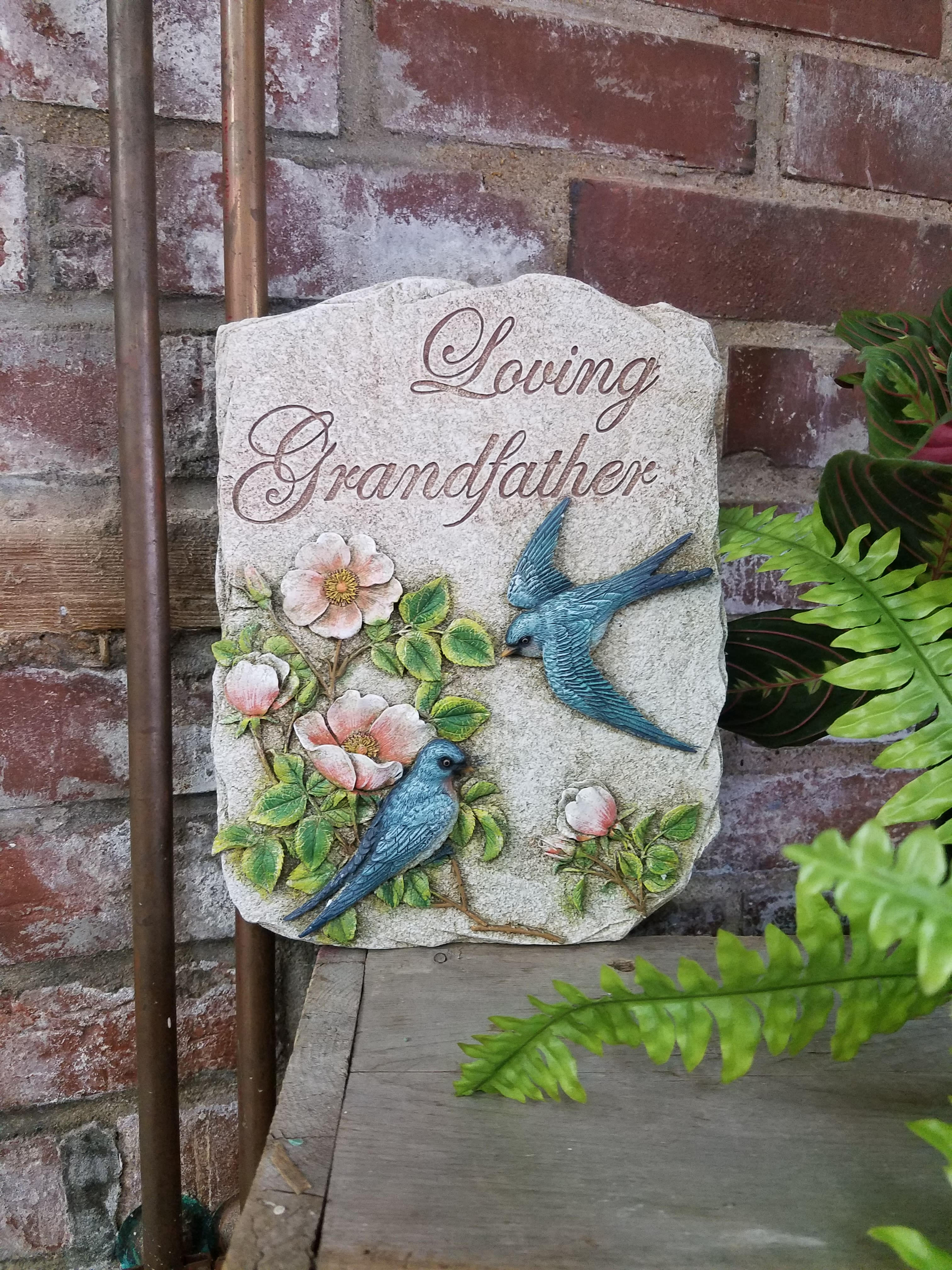 Eckert Florist's "Loving Grandfather" Memorial Stone *LOCAL DELIVERY ONLY Eckert Florist's "Loving Grandfather" Memorial Stone *LOCAL DELIVERY ONLY - Resin stone measures approx. 7.5" W X 10" H *May be added to a fresh arrangement or green plant. See Deluxe and/or Premium upgrades. *See Add-on Section for Display Easel *LOCAL DELIVERY ONLY