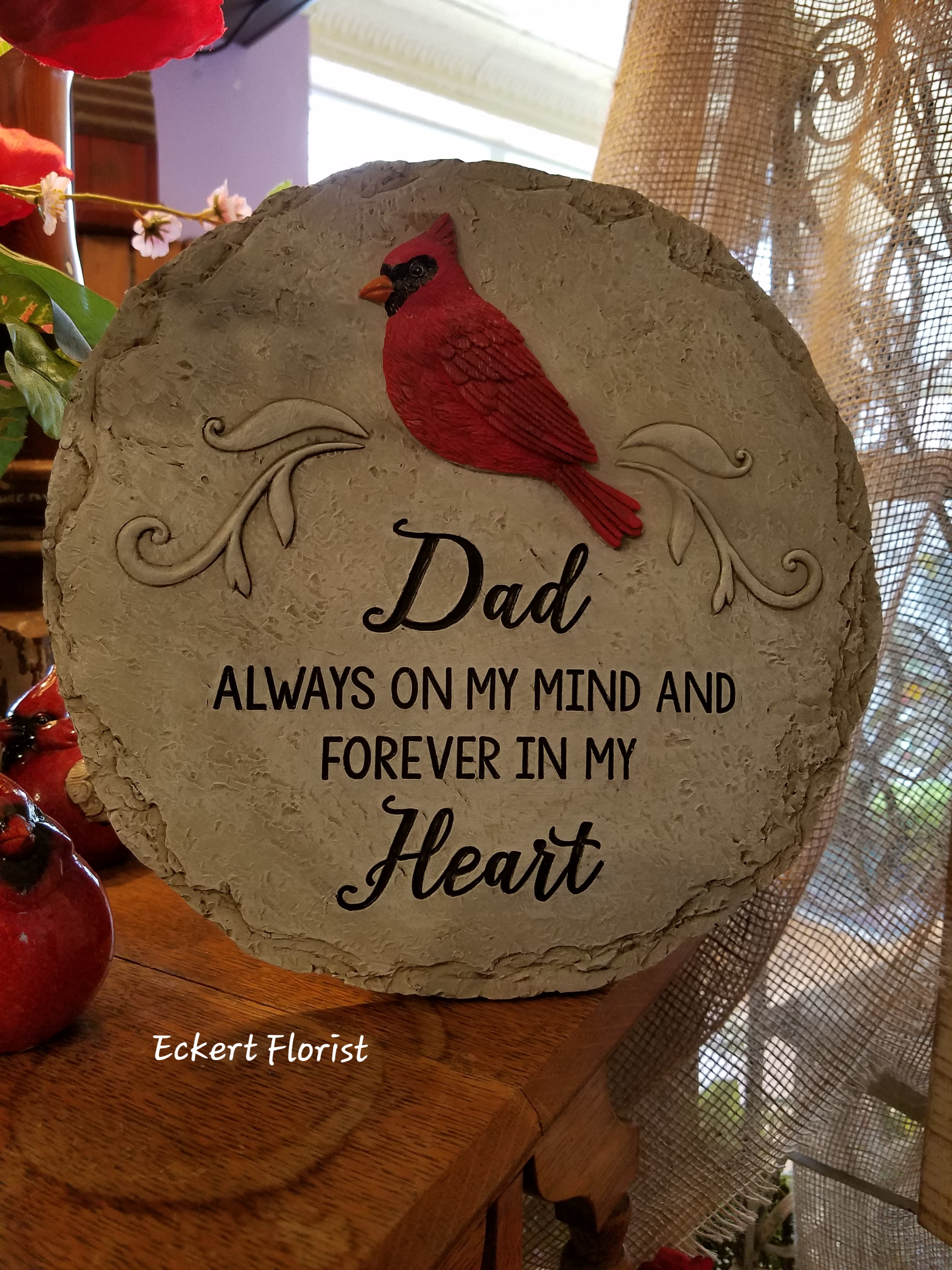 Eckert Florist's &quot;Dad...Forever in My Heart&quot; Round Memorial Stone *LOCAL DELIVERY ONLY - Resin round stone measures approx. 11&quot; Diameter This nice memorial keepsake may be sent to a funeral/memorial service or home. Can be added to a green plant or fresh arrangement. See Deluxe or Premium upgrades. *See Add-on Section for Display Easel **LOCAL DELIVERY ONLY*