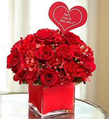 Red, Hot & Fabulous Red, Hot & Fabulous - She's a no-nonsense style queen who always gets it done. For a gift that implies all that and more, this gorgeous arrangement of roses, hypericum, alstroemeria and carnations is right on red. Hand-arranged inside a stylish clear glass cube vase. Item # 90946