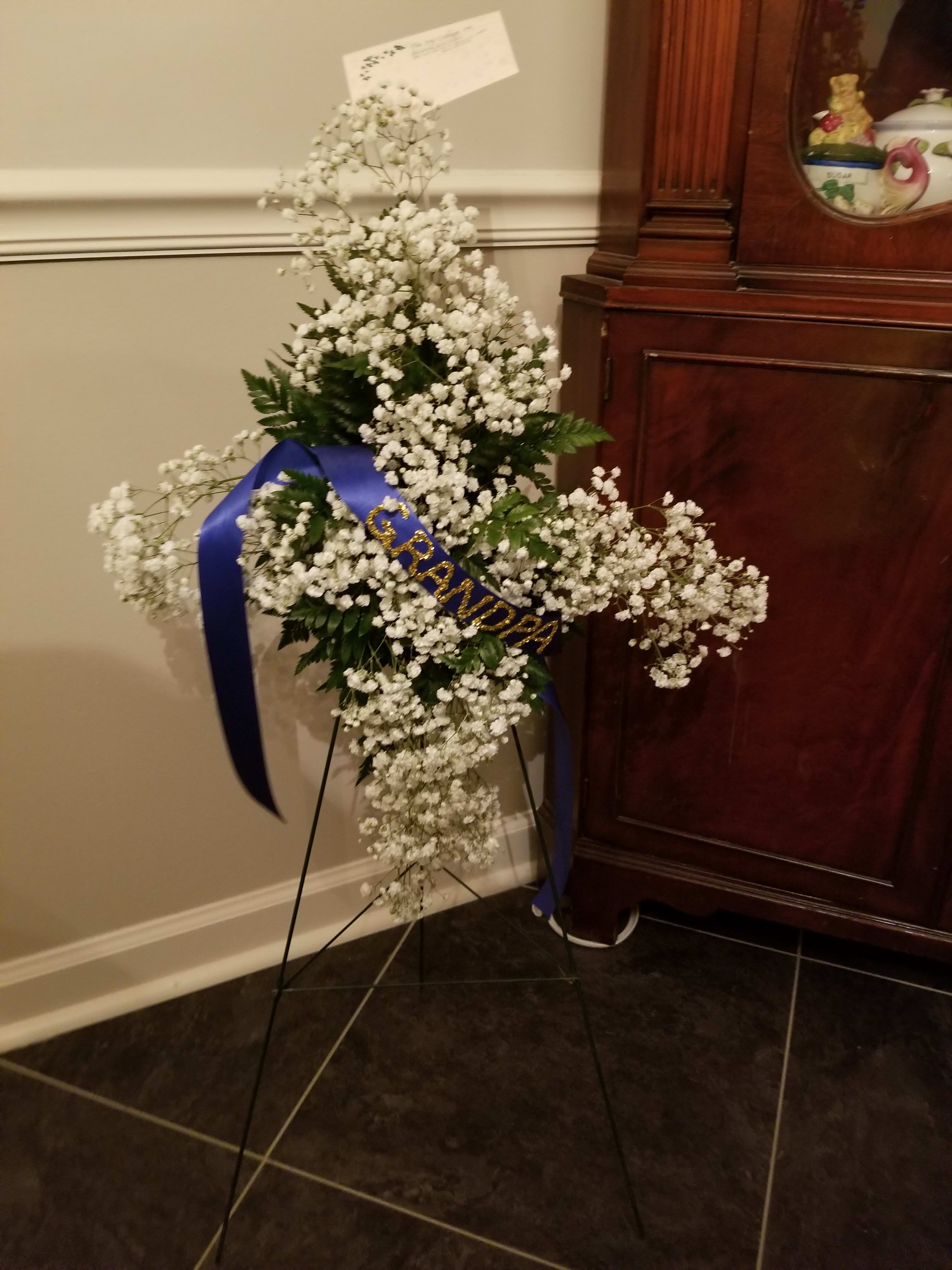 Baby's breath cross Baby's breath cross - A small cross design using clusters of baby's breathe and greenery. Banner optional. Cross is subject to change due to availability.