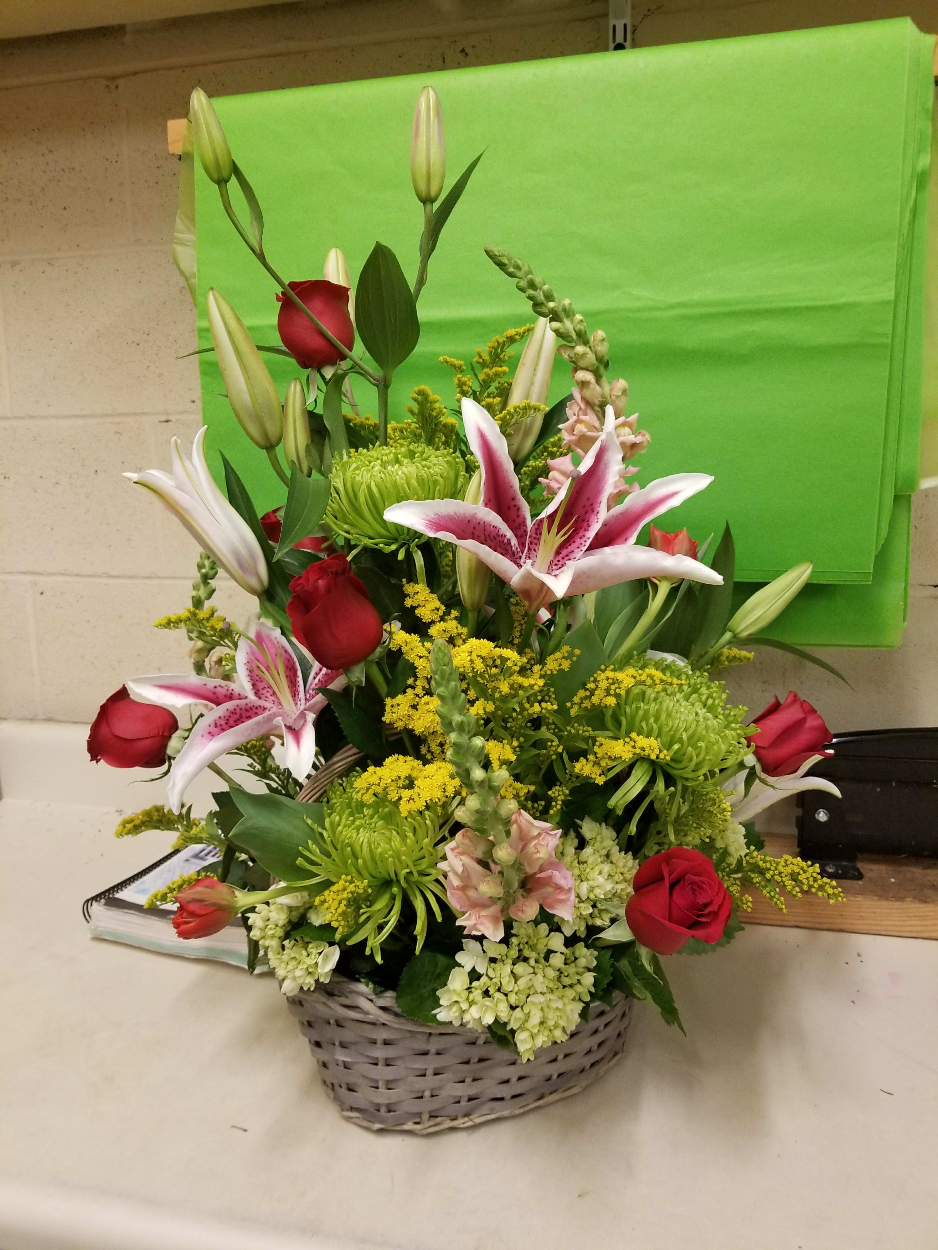 Lillies and Roses - Big rubrium lilies,  pretty red roses, peach snapdragons, yellow solidago and green fugj mums that will put a smile on your person you want to please face for sure!