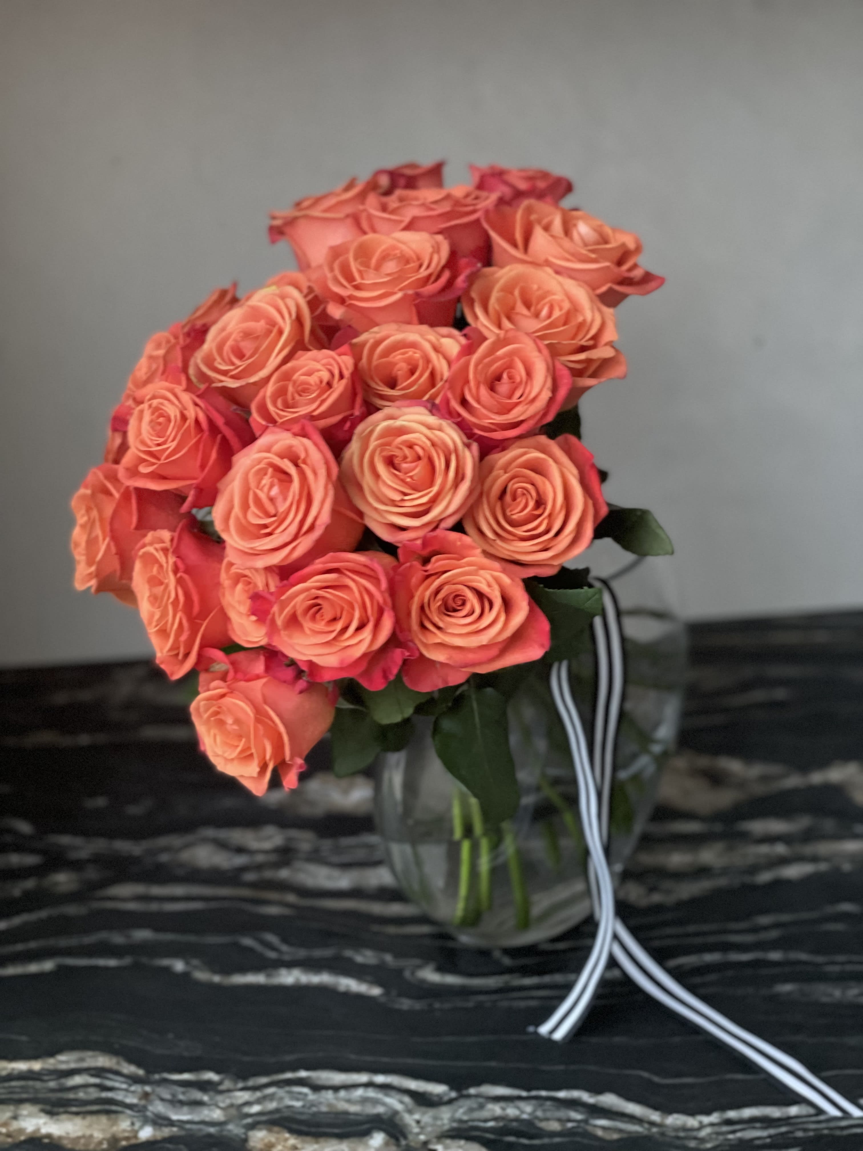 Two dozen roses - Hand-tied bouquet with your choice of rose color. (Vase is not included)