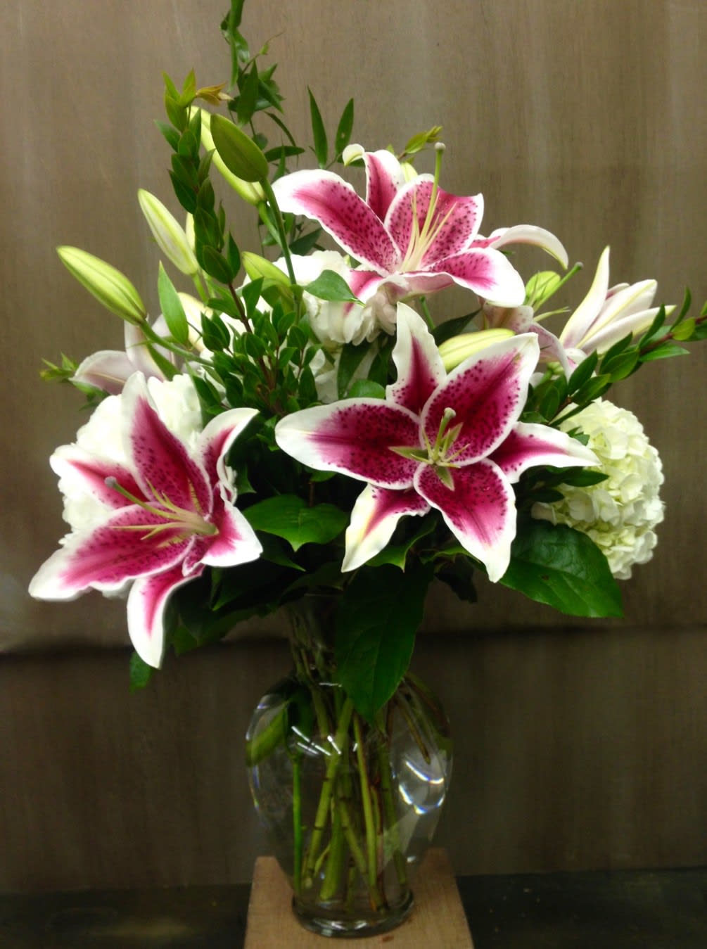 STARGAZER LILY  BOQUET   NEW-A105 - Our STARGAZER LILY  BOUQUET is a fragrant combination of Stargazer Oriental Lilies  and white hydrangeas in a quality glass vase.. This Lily arrangement makes a dramatic presentation and is appropriate for most any occasion.   