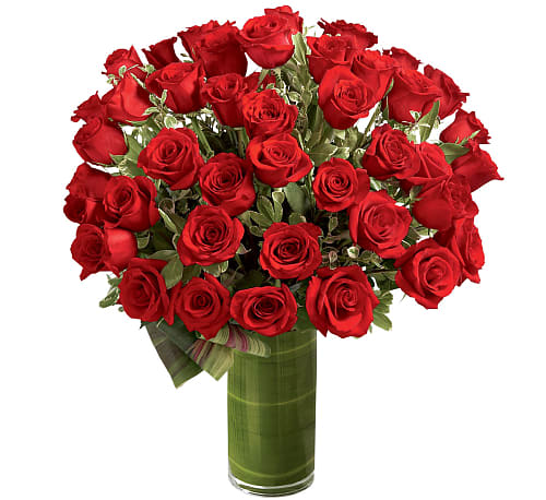 Fate Luxury Bouquet - Fate brought you together for this incredible moment. Celebrate your love and heartfelt emotion with a display of the most amazing roses. A gorgeous and lush bouquet of 48 premium red roses, beautifully situated in a clear glass cylindrical vase, is the perfect way to shine a light on your every emotion.