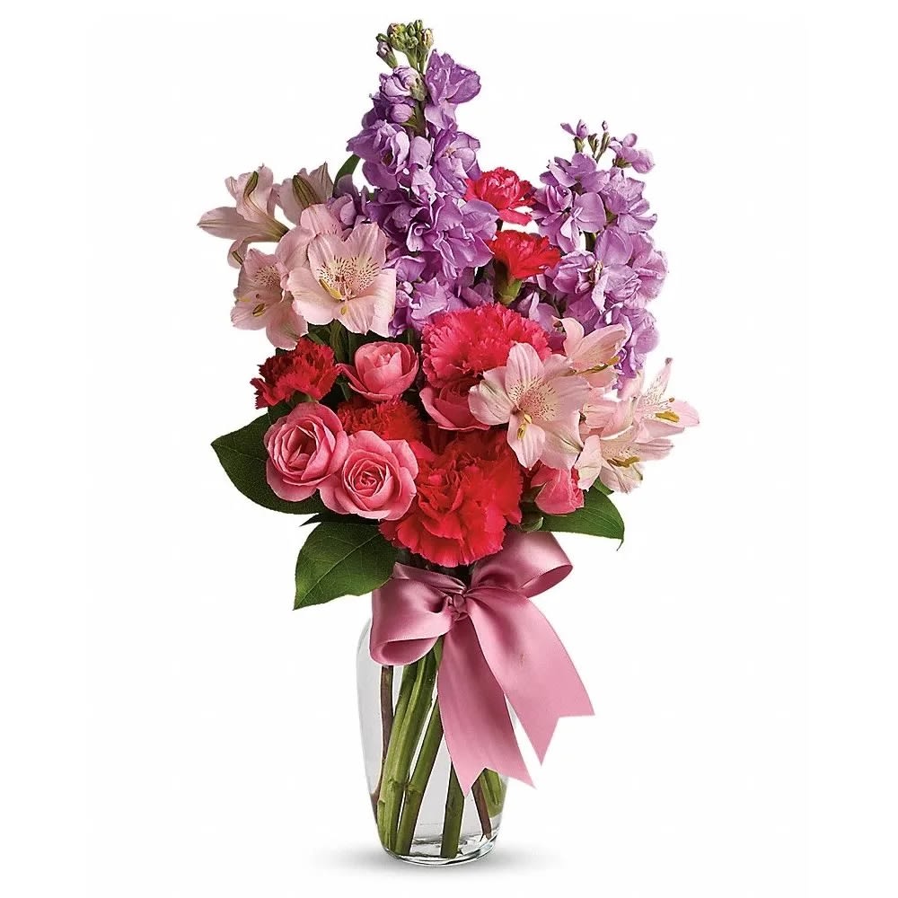 Jumping for Joy - Someone you know (or want to know!) will jump for joy when she receives this charming bouquet. Soft and feminine colors, flowers and textures are all wrapped up in one pretty package. Pink spray roses, light pink alstroemeria, hot pink miniature carnations, lavender stock and salal are delivered in a charming vase that comes with its own pink satin ribbon. When you come across something this lovely at this price, you've got to jump on it!