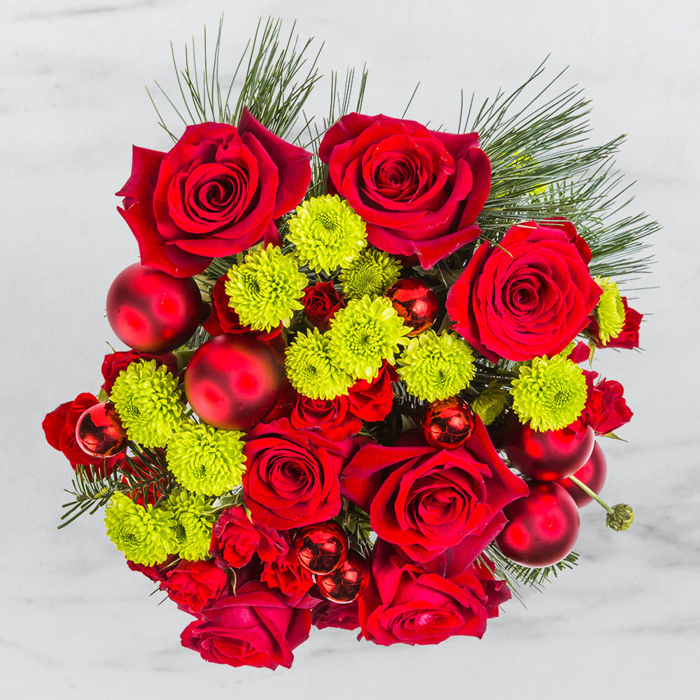 Warm Winter By BloomNation™ Warm Winter By BloomNation™ - Winter makes us appreciate warmth. Scarves, sweaters, and blankets make us feel warm and fuzzy in a way that just can’t be replicated in other seasons. Bring an extra layer of warmth into your life this winter with the Warm Winter arrangement. Note: this arrangement is not a substitute for a space heater.