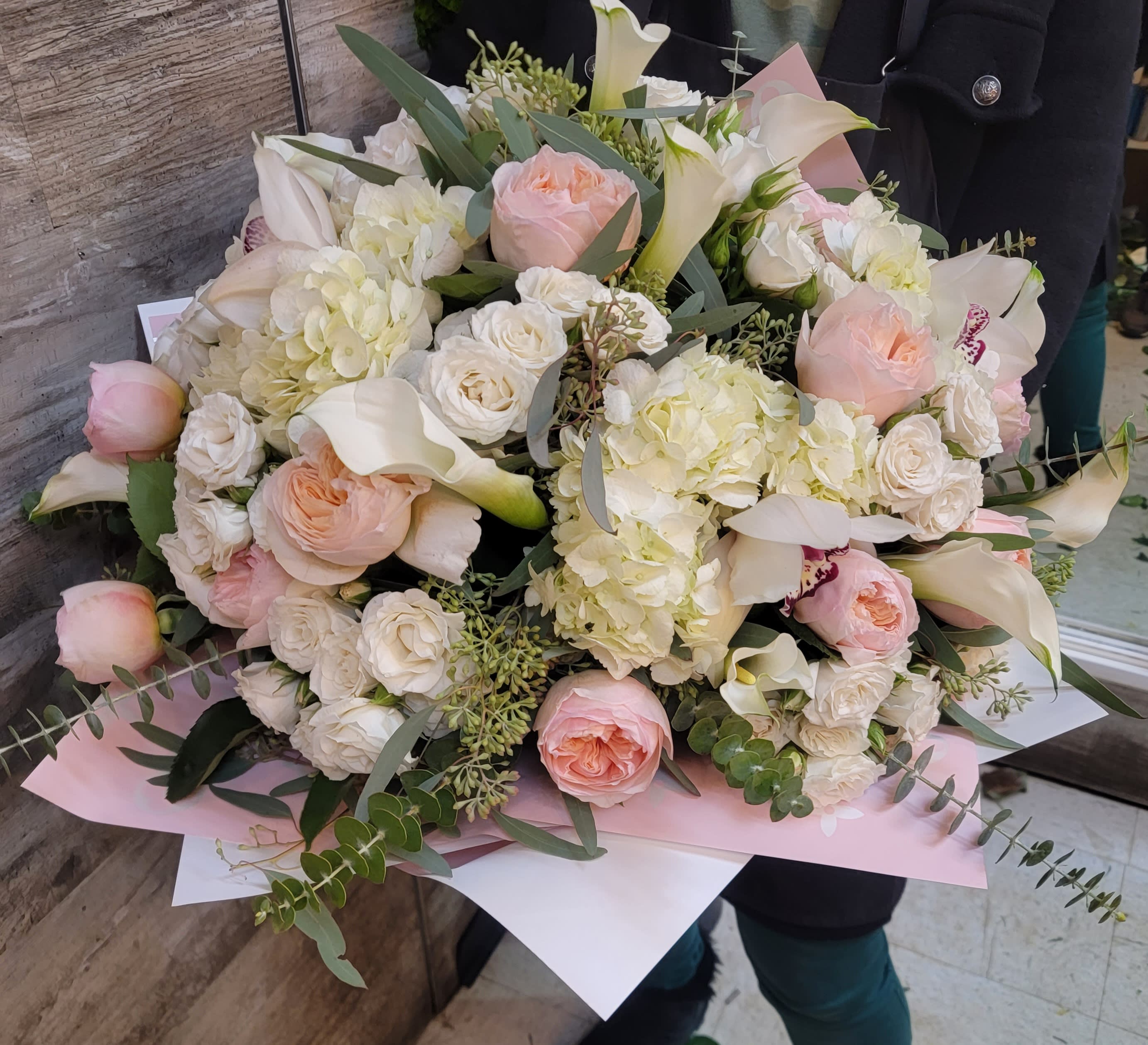 Wrapped cream colors flowers - Hadringias  , spray roses, roses,eucalyptus 