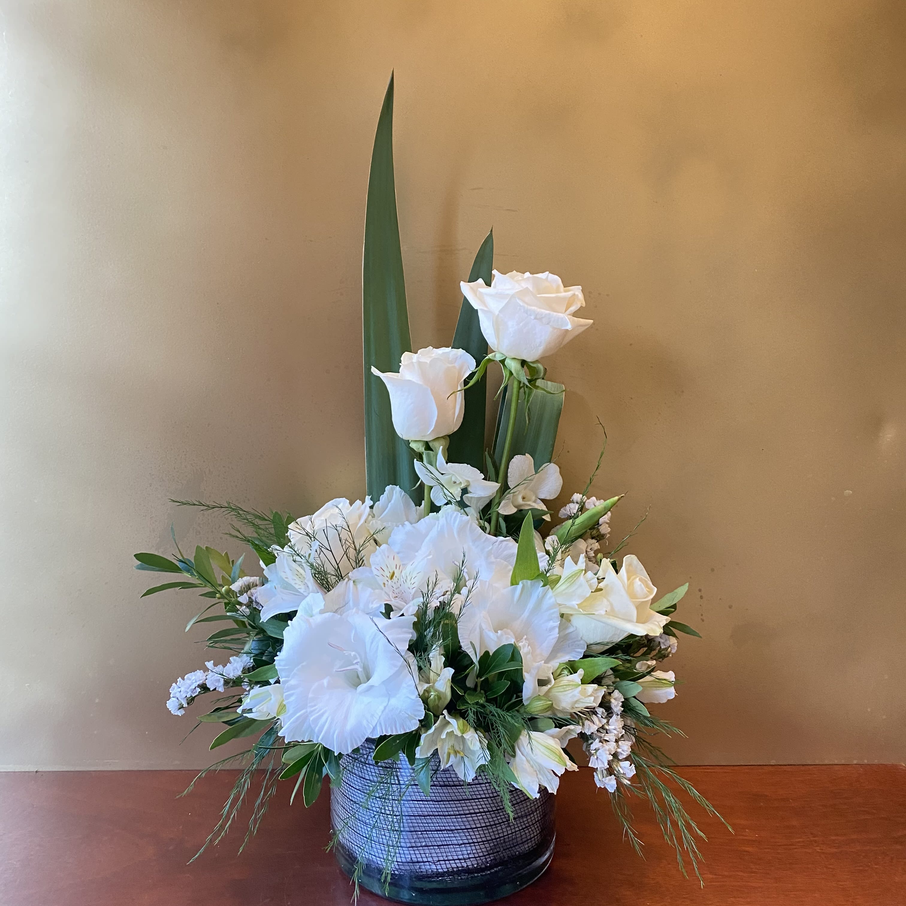 Classic All White Arrangment - White flowers have a certain timelessness and elegance, perfect for expressing your heartfelt condolences during times of sorrow.