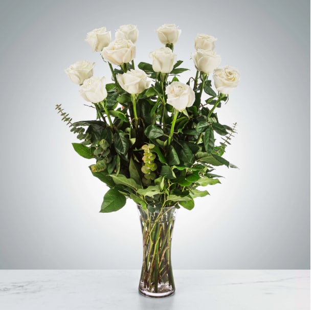 Dozen Long Stem White Roses by BloomNation™ Dozen Long Stem White Roses by BloomNation™ - A dozen white roses are a classic gift! Perfect for Valentine's Day, an Anniversary, or any type of celebration. Approximate Dimensions: 20"D x 30"H