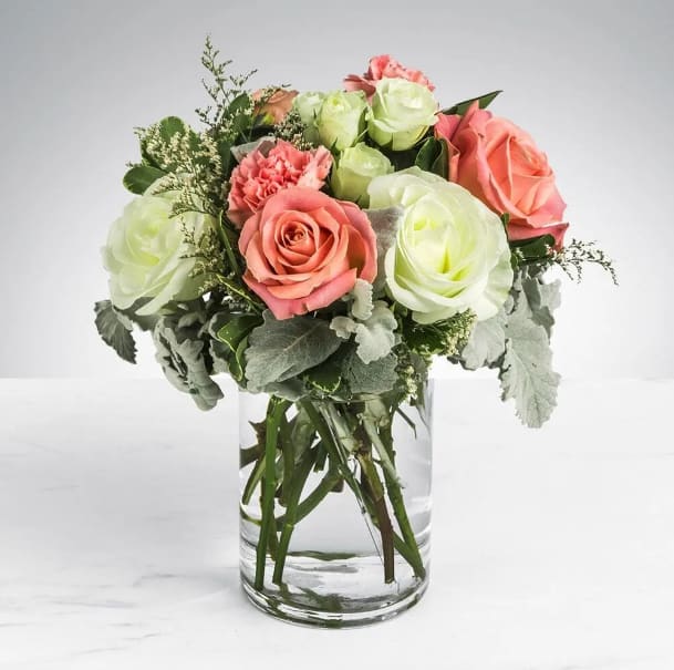 Sweet & Subtle by BloomNation™ Sweet & Subtle by BloomNation™ - This arrangement includes pink roses, white roses, white spray roses, pink carnations, and dusty miller. Sweet & Subtle by BloomNation™ is the perfect gift for a birthday, thank you, or just because. APPROXIMATE DIMENSIONS: 9" H X 10" W
