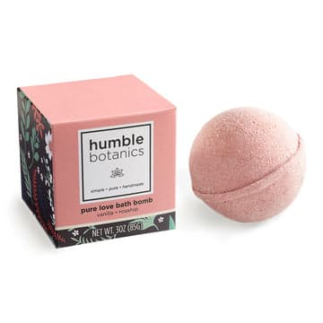 Pure Love Bath Bomb - Our handmade Pure Love Bath Bomb Single includes 1 3oz bath bomb that soothes sore muscles, softens skin, and provides aromatherapy. Instead of using synthetic dyes and fragrances to achieve the color and scent, we've developed a simple, non-toxic approach. Our Pure Love Bath Bomb is comprised of rose kaolin clay, and a blend of vanilla hydrosol, and organic rosehip seed oil.   Ingredients:  Sodium Bicarbonate, Citric Acid, Rose Kaolin Clay, Rosehip Seed Oil*, Vanilla Hydrosol, Witch Hazel* *Organic Ingredients  *Our bath bombs are biodegradable! We've also constructed our packaging to be as eco-friendly as possible while protecting our pure essential oil scent. Currently sold with the following RECYLCABLE packaging elements:  -Box/Sleeve -Silicone Coated Paper Bath Bomb Wrap -Bath Bomb Sticker 