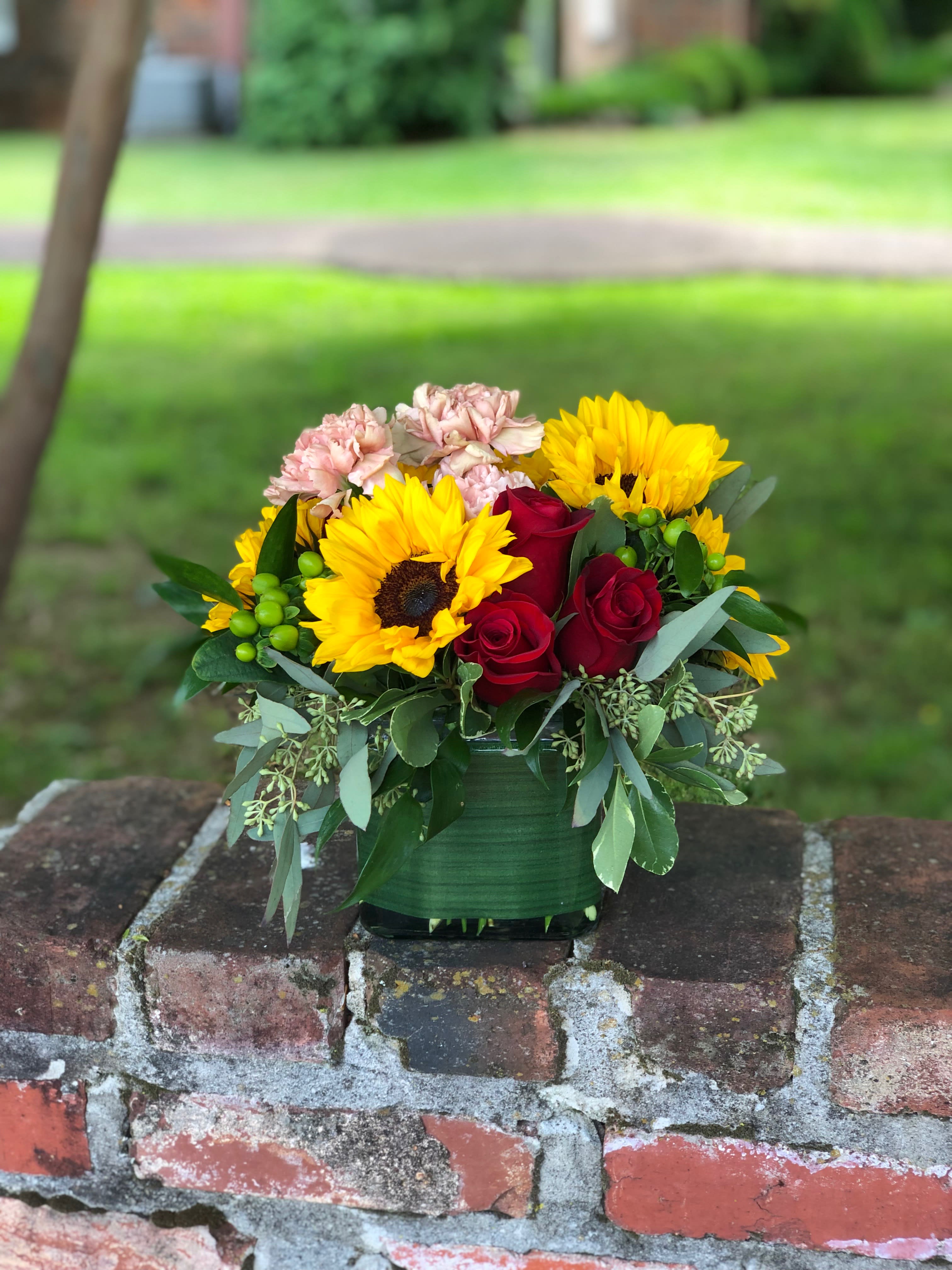 Season For Sunflowers - A timeless combination of red roses and sunflowers accented with greens &amp; pinks! Perfect for any occasion! 