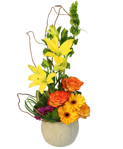Rich  Bold - Stone Container Foliage: Curly Willow Aspidistra Lily Grass High Magic Roses Orange Gerberas Purple Carnations Green Dianthus Bells Of Ireland Yellow Asiatic Lilies.