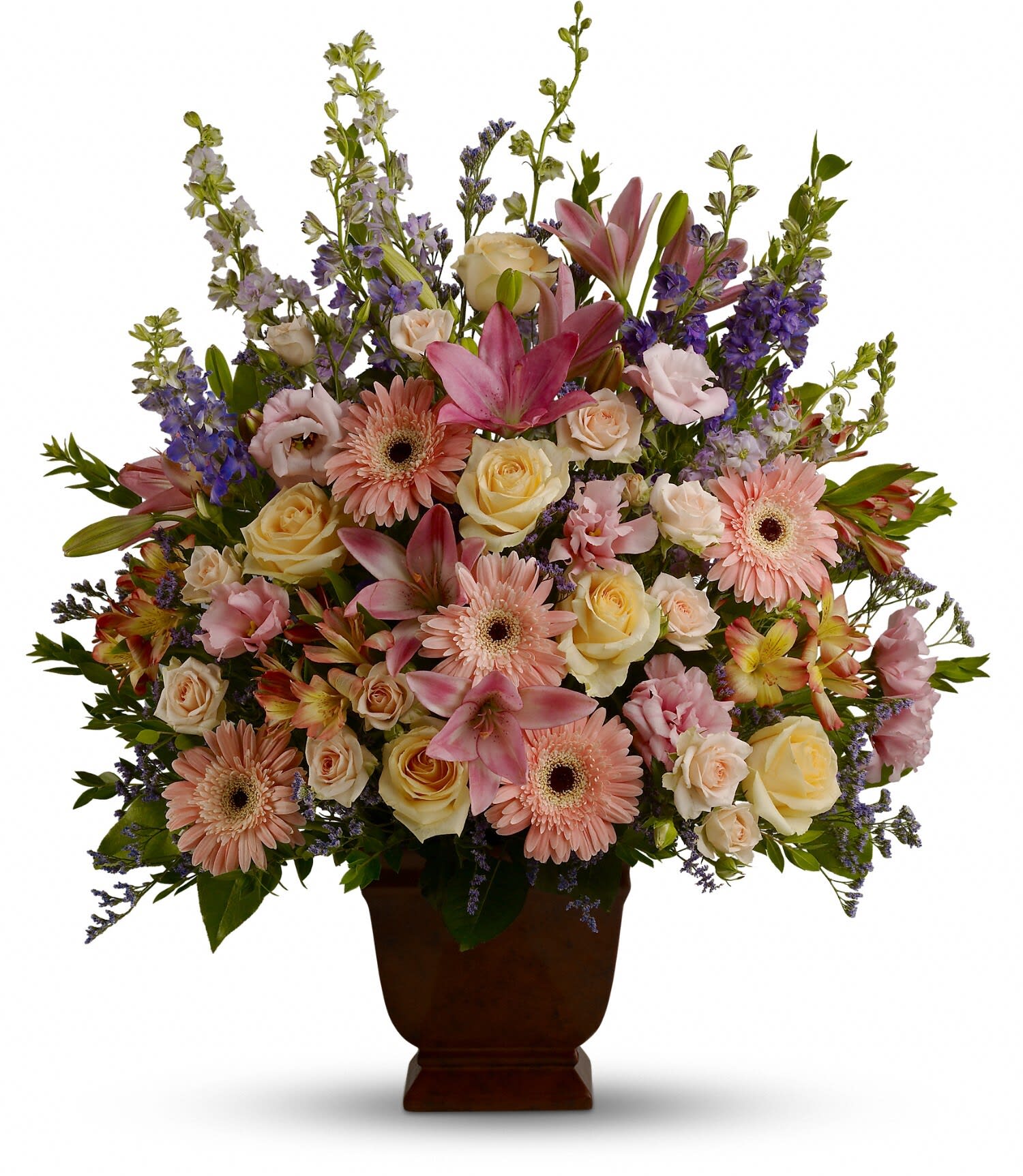 Loving Grace - T220-1A: A warm and peaceful bounty of pastel blossoms gently expresses love and respect. A gracefully composed arrangement appropriate for home or service.  Fresh flowers such as peach and light pink roses, lavender and purple larkspur, pink asiatic lilies, alstroemeria, gerberas and lisianthus are set in an exclusive Noble Heritage urn.   Approximately 26&quot; W x 30&quot; H Orientation: One-Sided As Shown: T220-1A 