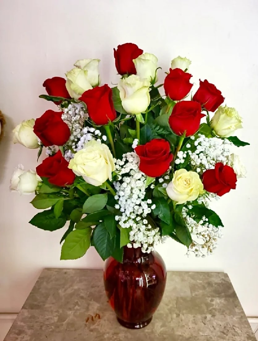 VDAY 4 VDAY 4 - This beautiful arrangement comes with 24 roses medium stem (50-60 cm) in glass vase with green and baby's breath. Please call or write in card message area which color roses you'd like between red/white or full red or full white.