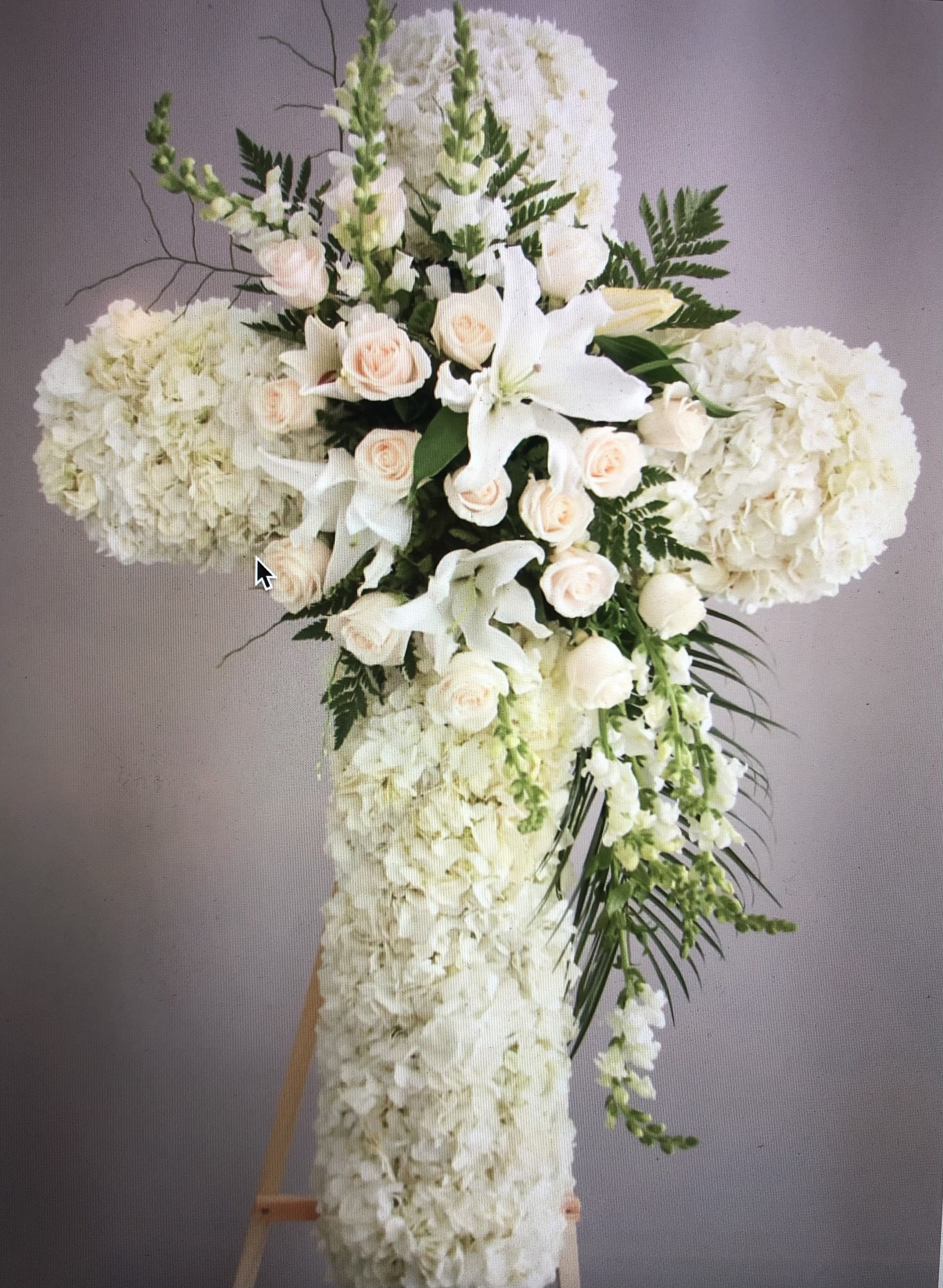 Sympathy Cross Sympathy Cross - White flowers arranged in cross shape for Funeral services. stands on tall easel for more dramatic look.