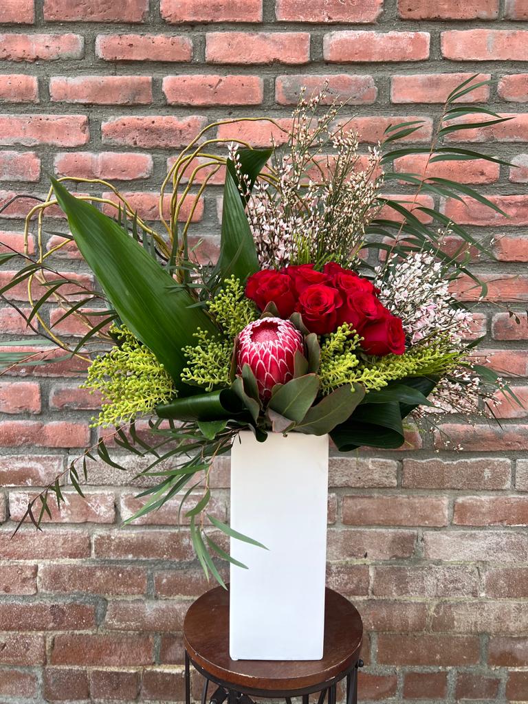 Modern love - 1 dozen red roses with a curly willow heart,ginestra,brazila berry,protea