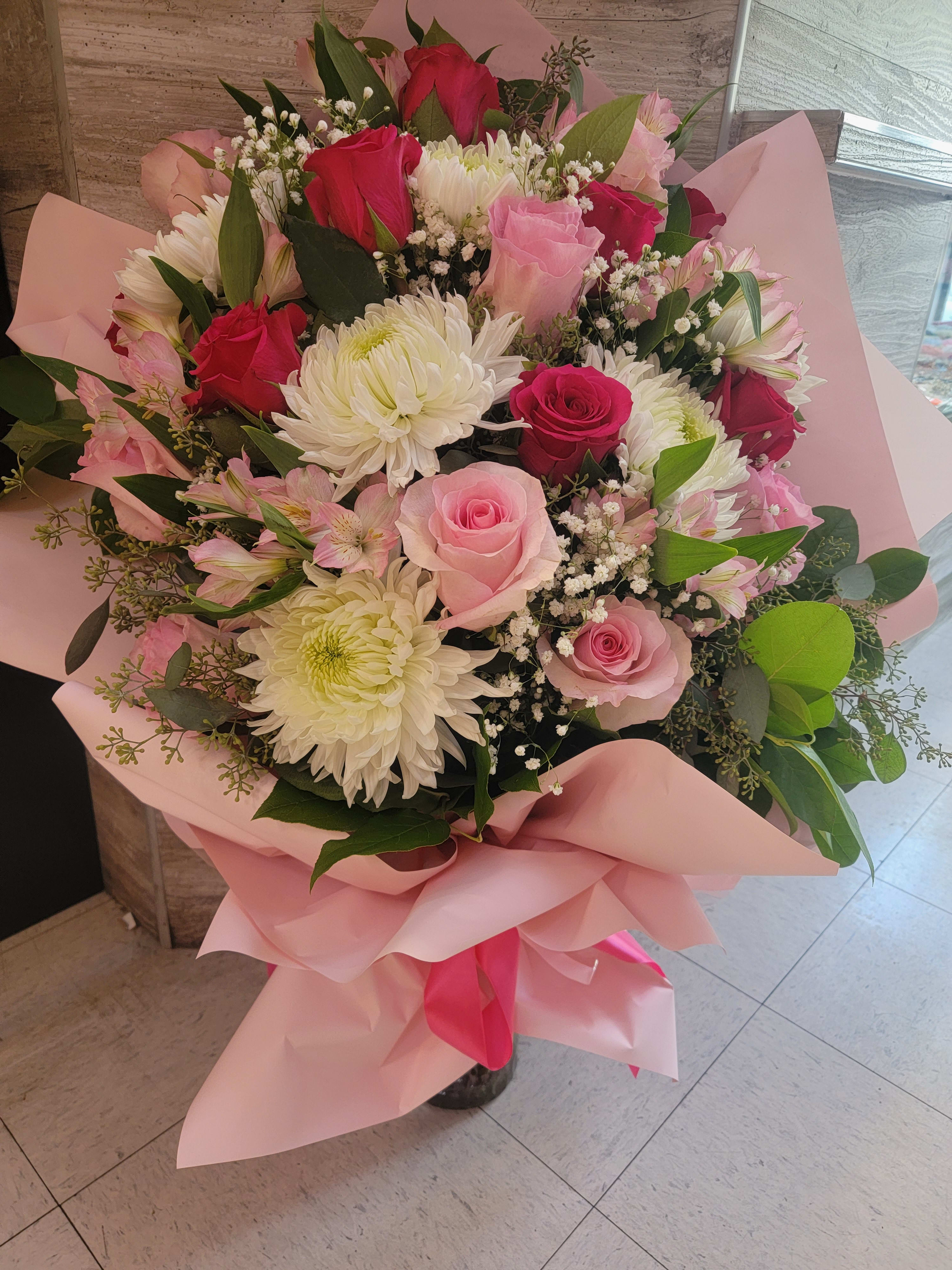 Wrapped pink bouquet  - Roses,daisies, alstroemeria 