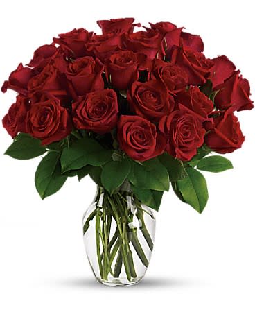 Enduring Passion - Double her pleasure, double her fun with two dozen gorgeous red roses arranged in a sparkling clear glass vase. This truly breathtaking gift will make her fall in love with you all over again. Which will double your pleasure and fun, too. SUBSTITUTION POLICY – Always deliver the freshest flowers! Please note the bouquet pictured reflects our original design.  If the exact flowers or container in this arrangement are not available, our local florists will create a beautiful bouquet with the freshest available flowers.         •This spectacular bouquet includes 24 red roses accented with lush greenery.  •Delivered in a clear glass rose vase. •Orientation: All-Around • All prices in USD ($) 
