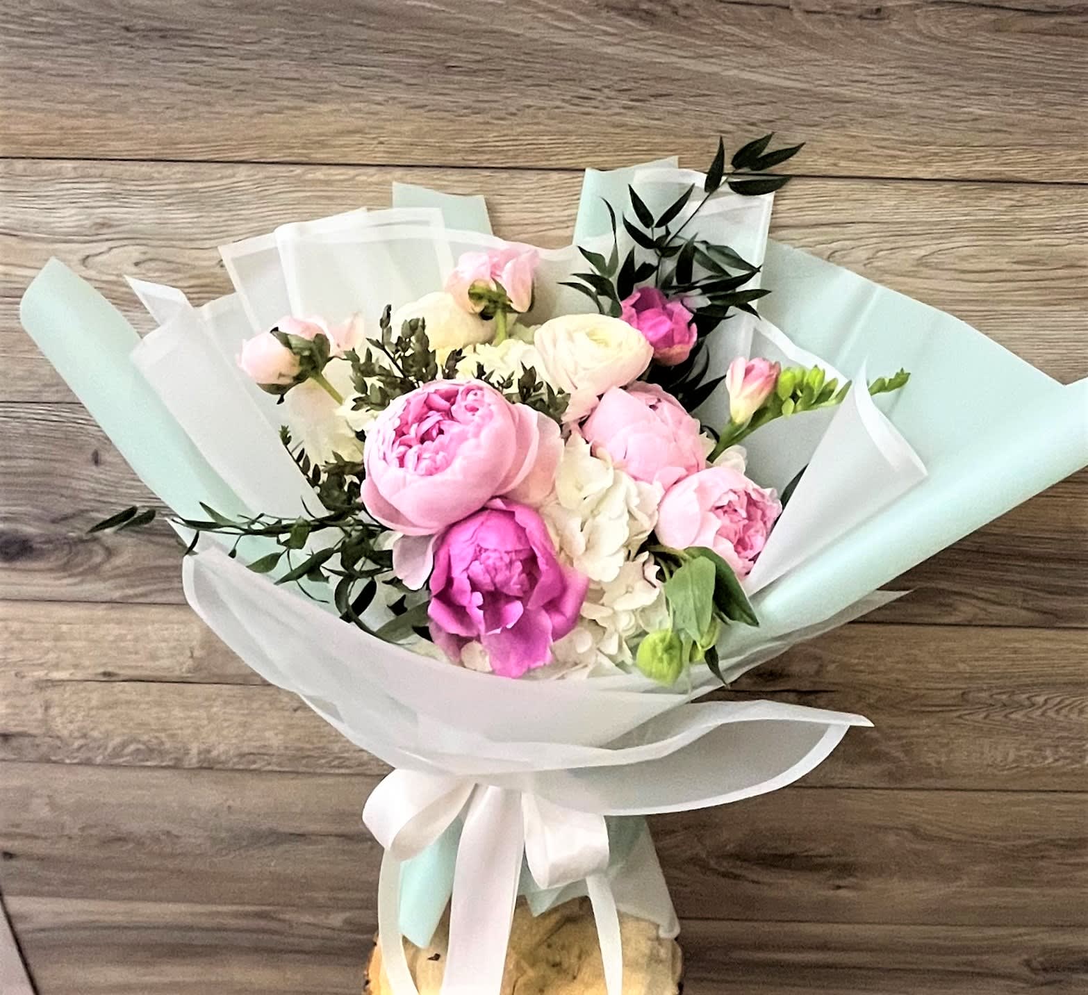 Hestia Hestia - Lighten up any environment with this bouquet of beautiful pastels. Sometimes all that's needed is a little blush. Chloe does that and with fanciful elegance. Soften the mood, relax, and breathe in; make life even better with this quaint batch of muted roses and peony and hydrengea.