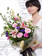 GD4 - Pretty In Pink Presentation Bouquet GD4 - Pretty In Pink Presentation Bouquet - This presentation bouquet in sumptuous shades of pink and purple includes a generous selection of heavenly fresh flowers. The complementary hues give depth to the design. It’s sure to look stunning when it is presented, and will look beautiful wherever it is displayed. Featuring light pink large headed roses, cerise carnations, pale pink germini, purple lisianthus and pink Oriental lilies expertly arranged with trailing fern, aspidistra and ruscus and finished with gift wrap and ribbon.