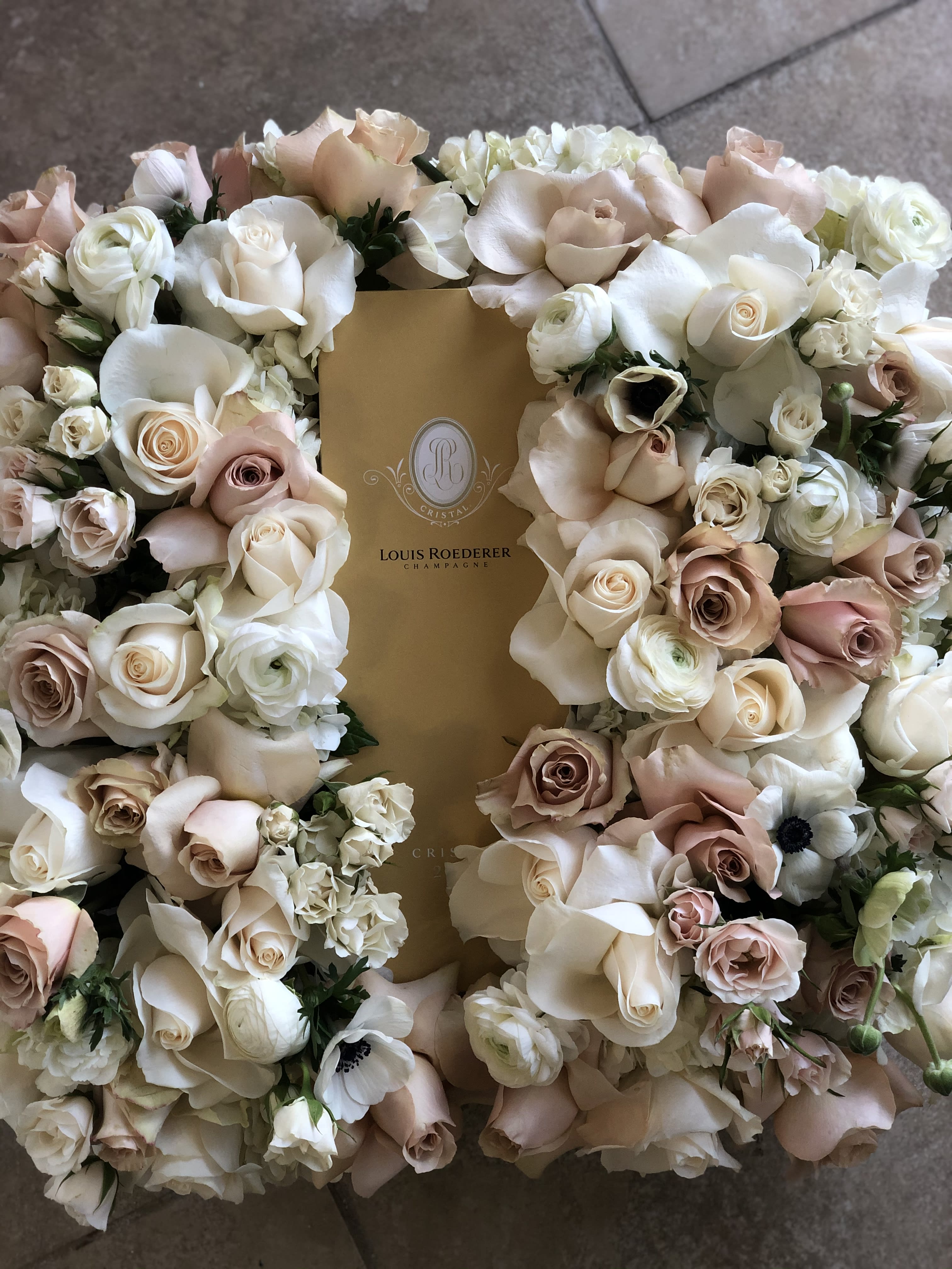 Sparkle florals  - Gifts setting in a square box with   Louis Roederer Champagne Brut Cristal  surround by floral 