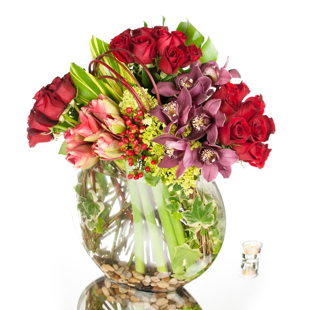 Visions of love - Set to capture their attention, this fresh flower arrangement brings together red Roses, purple Cymbidium Orchids and other seasonal florals to create an arrangement that is simply a vision in itself. This stunning floral design is a sensational way to express your love and gratitude.