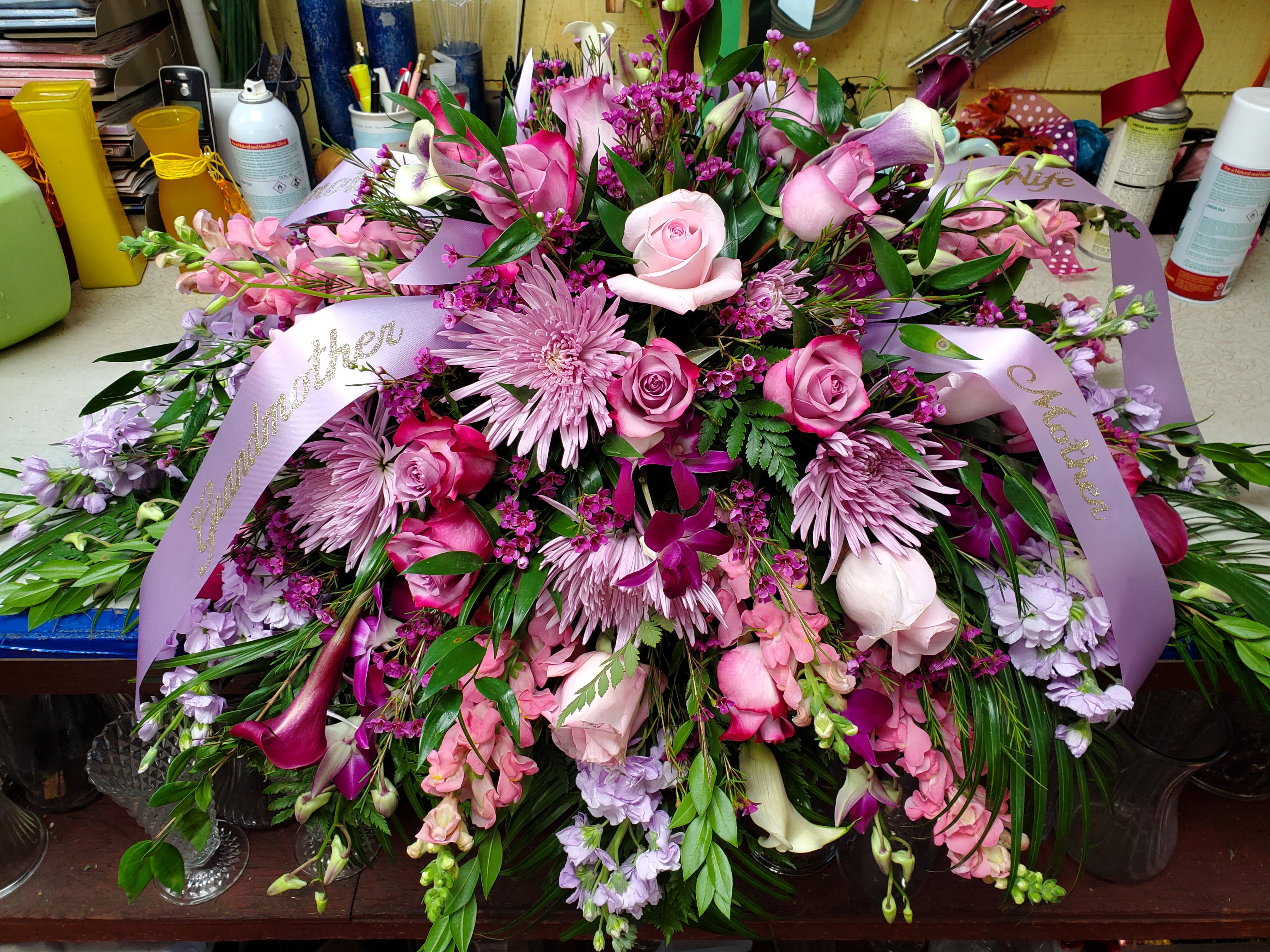 Pink and Purple Passion Casket Spray - Gorgeous casket display showing Roses, Mums, Orchids, Cala's, Snaps, fillers and greens 225.00-300.00