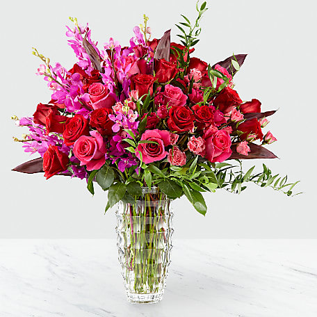 Luminous Luxury Luminous Luxury - Classy dendrobium orchids and an array of roses fill this luxurious vase