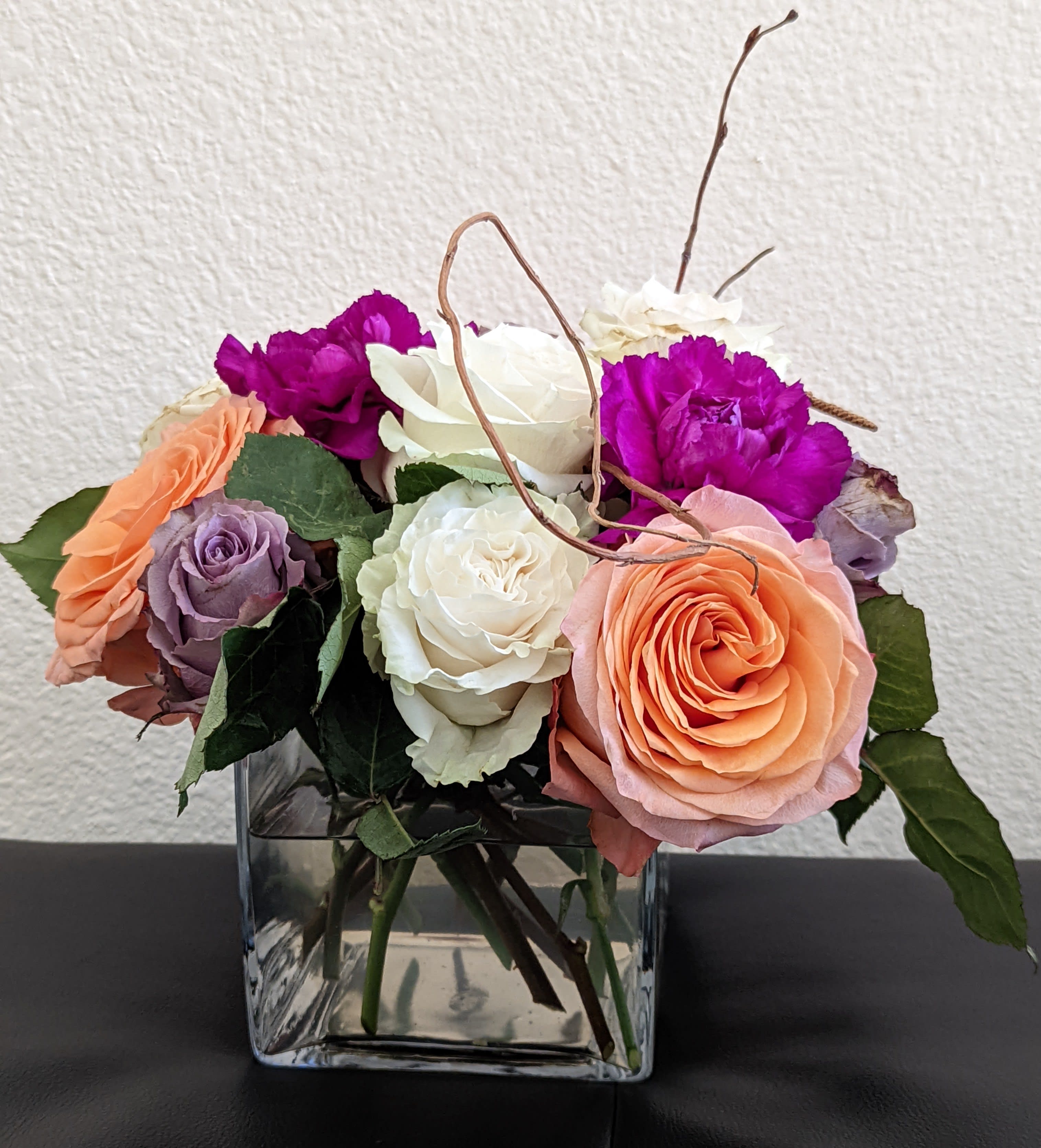 Blooms Blooms - MIxed colors , cheerful and bright. In a decorative glass vase, perfect for any occasion. Colors may vary depends upon the availability.