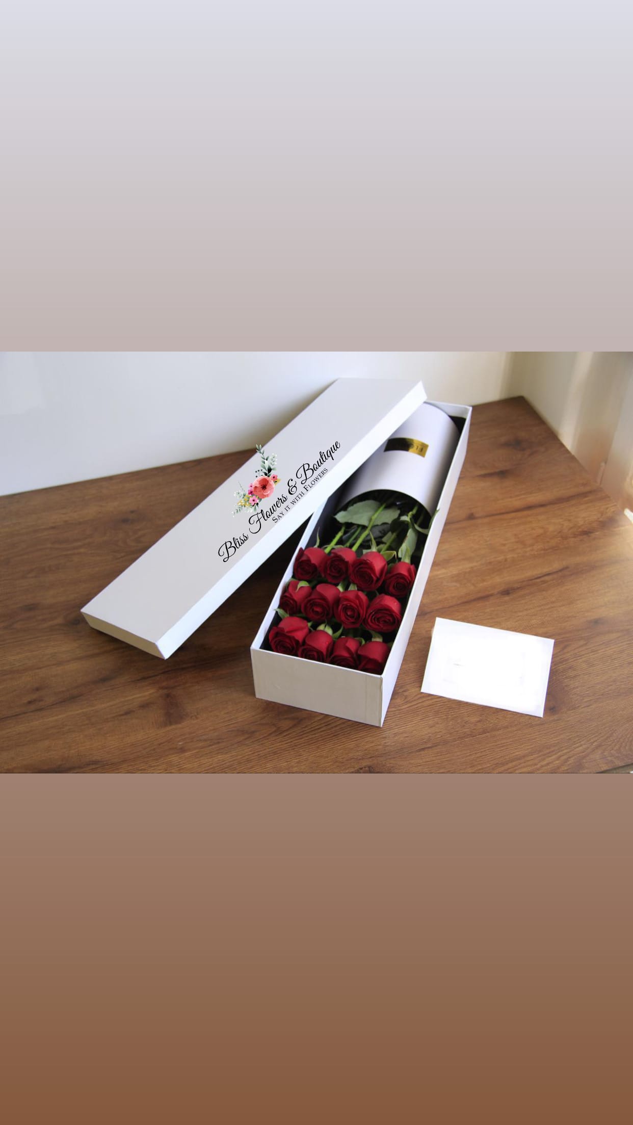 Premium Boxed Roses  - One dozen roses arranged in a premium white box. Express your love in a classic and timeless way with this arrangement. 