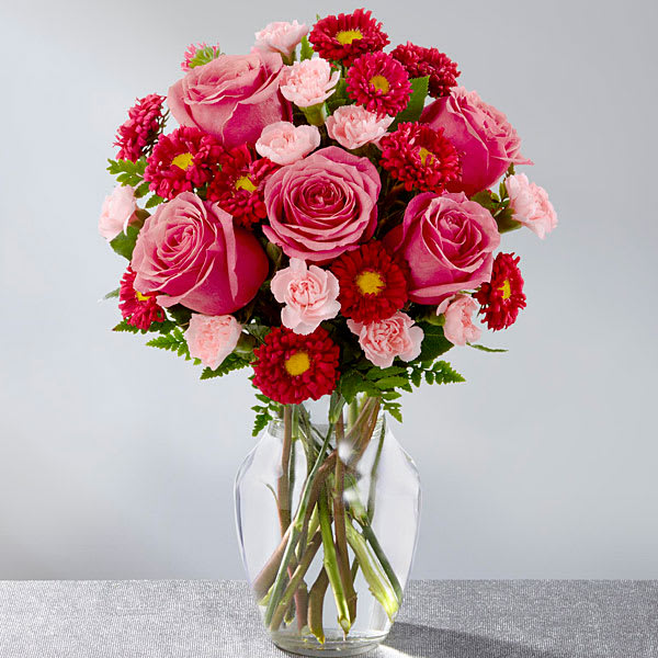 The Precious Heart Bouquet - The Precious Heart™ Bouquet is an expression of love and sweet surprises that is set to truly delight your special recipient! Popping with the swirl of hot pink roses surrounded by the alluring textures of red matsumoto asters and pale pink mini carnations all beautifully accented with lush greens this fresh flower arrangement has a winning look everyone can appreciate. Presented in a clear glass vase this gorgeous flower bouquet is ready to create an excellent birthday thank you or anniversary gift. GOOD bouquet is approx. 14&quot;H x 12&quot;W. BETTER bouquet is approx. 15&quot;H x 13&quot;W. BEST bouquet is approx. 16&quot;H x 14&quot;W.