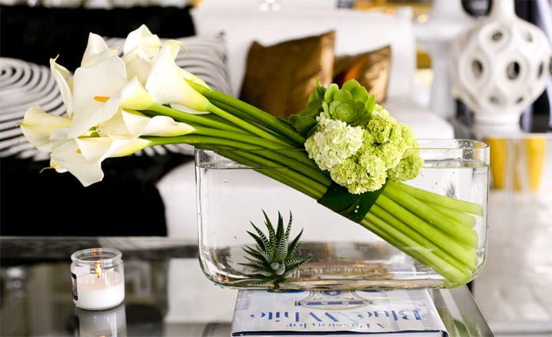 Skewed Callas - Perfectly angular white calla lilies, assorted succulent plant accents, and green hydrangeas in a modern and upscale design. 