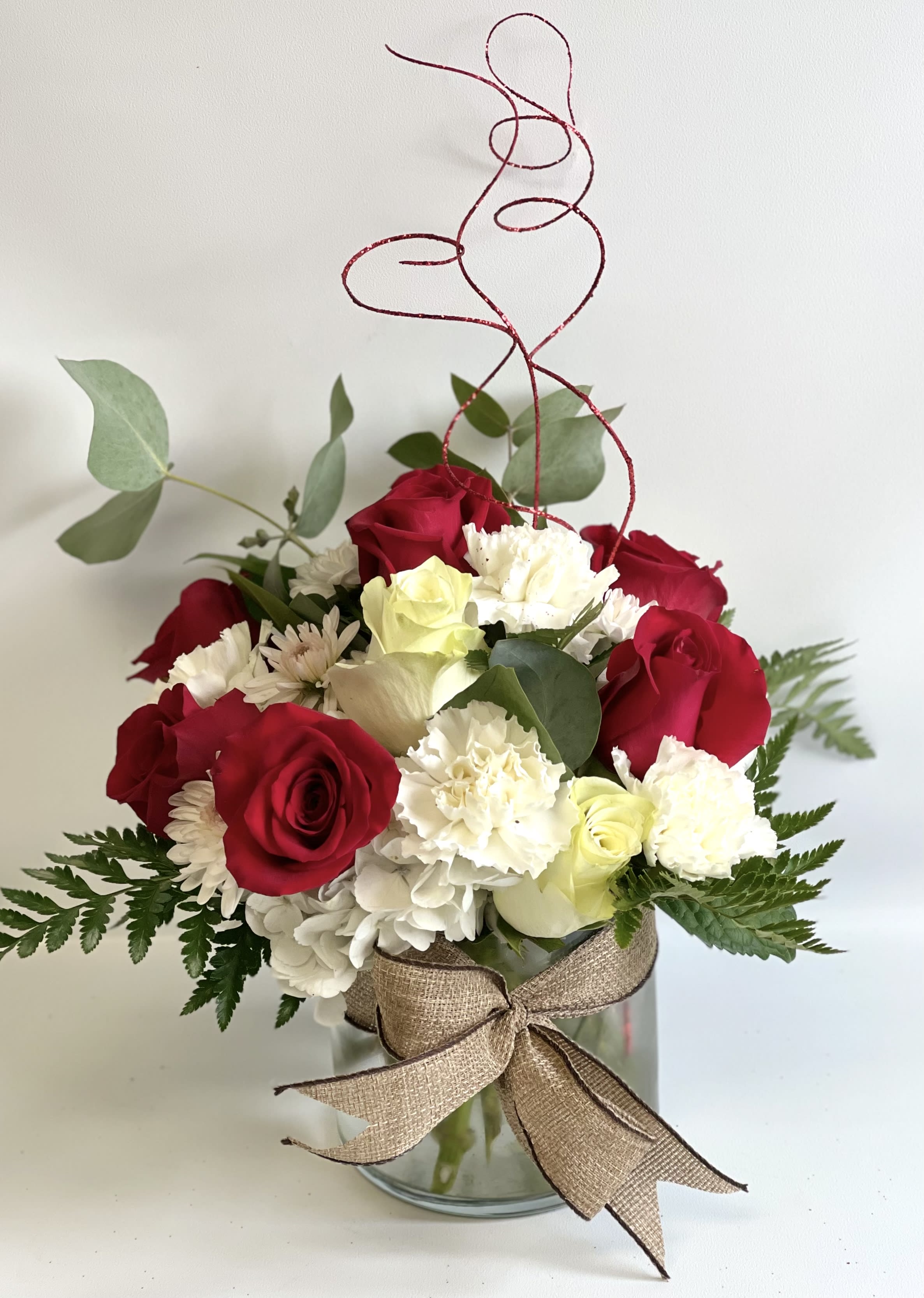 Sweetheart by Barb’s Flowers - This sweet bouquet is done up in a large glass cylinder with hydrangea, roses, carnations, and other flowers.  