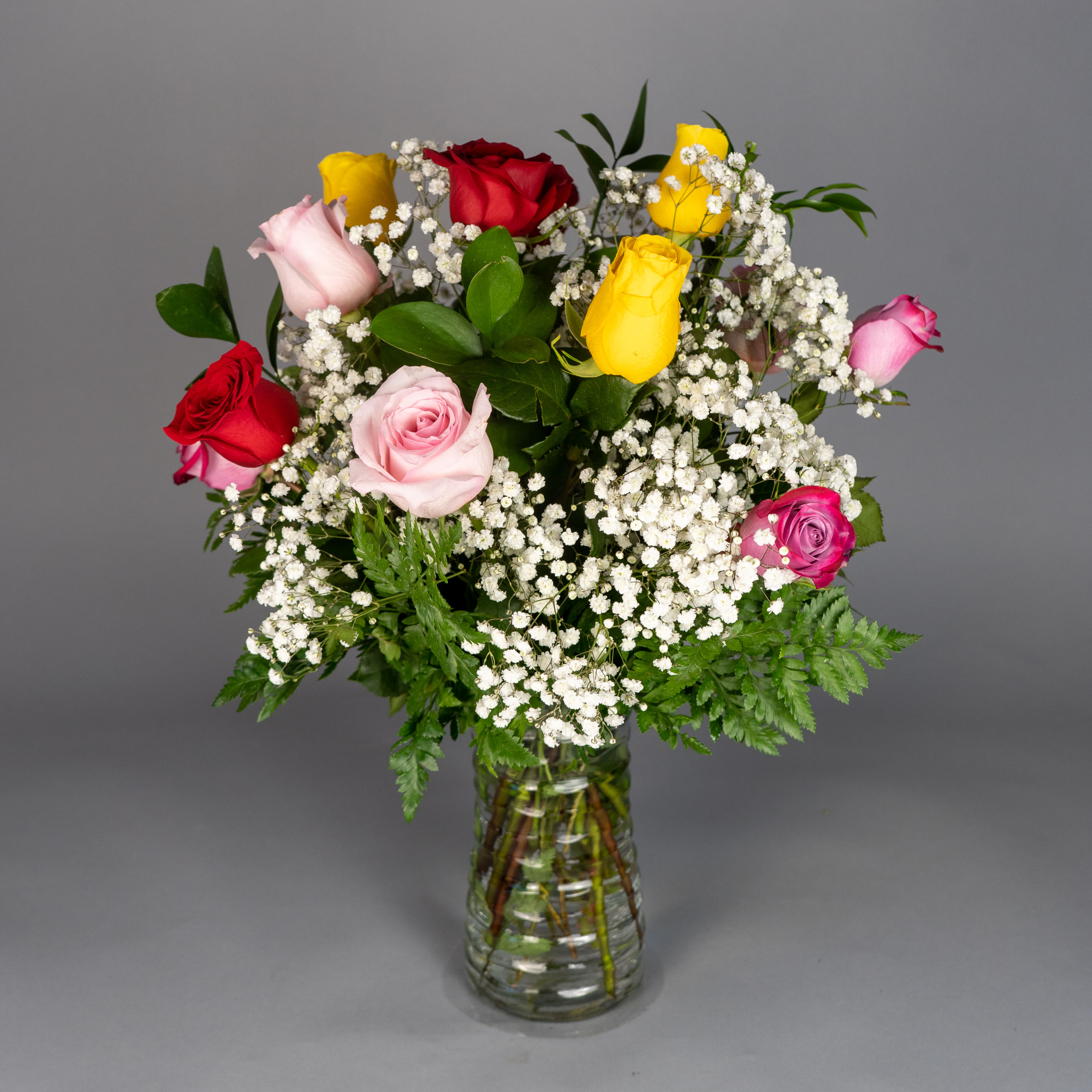 Assorted Rose Elegance - Our skilled florists handcrafted a stunning bouquet of spectacular, long-stem mixed roses that perfectly accents any event.