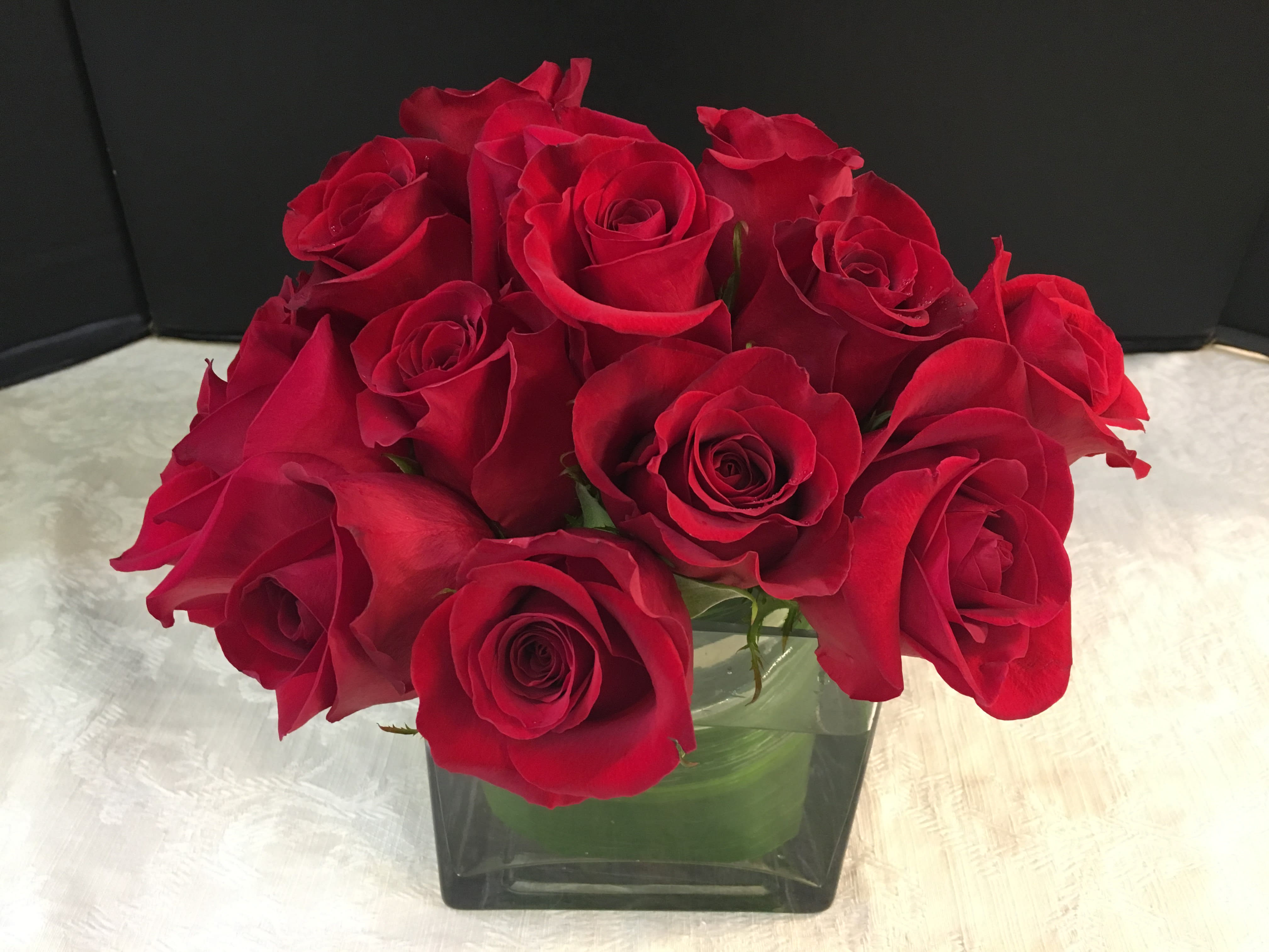 Rosy Patch - Premium  Red Roses with Fancy Greens. If you don' t desire Red  please specify.  Color may not be Available for Same Day Delivery. Call the Store for availability. (908) 234-2900 