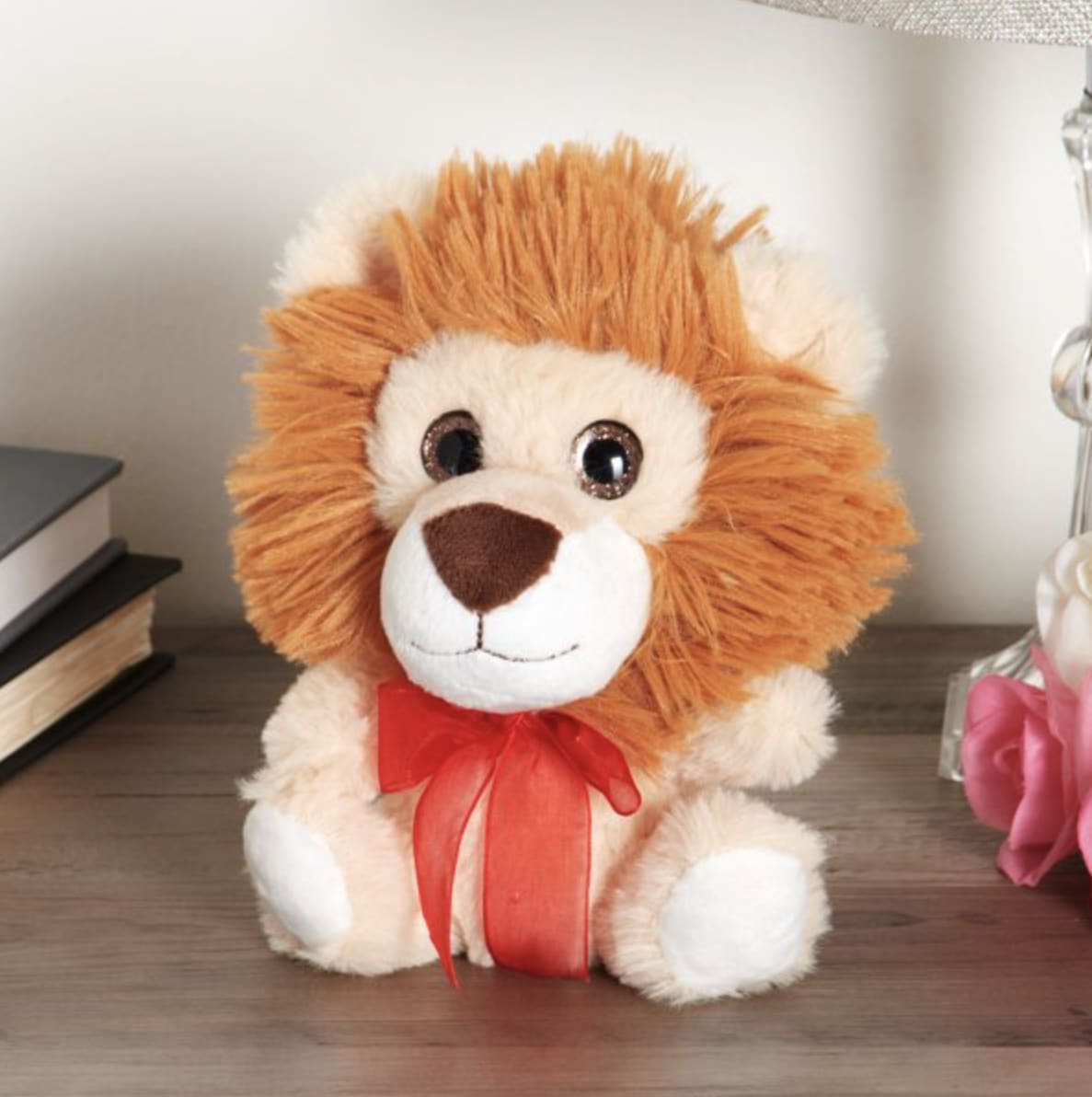 Lil Jungle Lion - This cute lion stuffed animal will make the perfect companion for anyone! It's made of super-soft, high-quality material that will make you want to cuddle with this sweet plush lion for hours. It's designed with soft fur, beautiful big eyes, and a red bow tied around its neck. Let your special someone know that you love them very much with this sweet little lion. (7&quot;H) Will be packaged in a deluxe gift bag with tissue paper &amp; bow. 